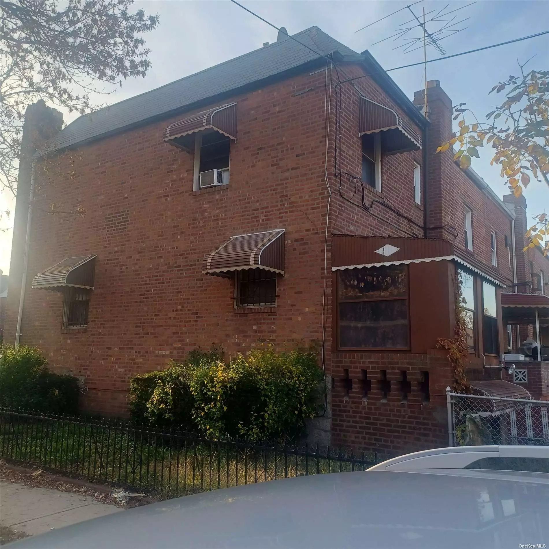 Sold AS IS. NEEDS Repairs/TLC. Nice 1 Family Brick Semi detached corner starter house wihich has high Ceilings and potentential. Nice basement Family room with bar and half bath and access to a garage and a driveway with an extra room.