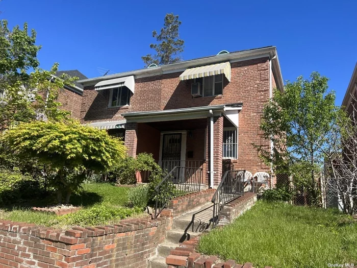 Well-maintained sime-attached Brick house facing south, wood floor, finished basement,  one car garage attached at the rear of the house, wide driveway fits in 2 cars. Located at the center of fresh Meadows, very quiet neighborhood, and close to all. Must see!