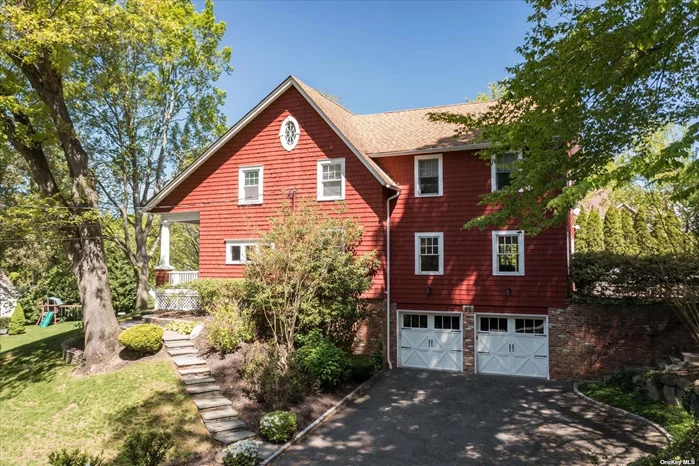 Historic meets modern in the heart of Roslyn Village. This colonial revival home was originally built in 1908 and later moved to its current location. An expansion to 3, 100 sq ft plus a fully finished walk- out basement, as well as recent renovations, exceeds all expectations of today&rsquo;s buyer. Step inside off the scenic front porch to a formal living and dining room. New chef&rsquo;s kitchen with oversized center island and gas cooking opens to sunlit family and breakfast rooms. A powder room and back porch complete this level. The second floor offers a truly special primary suite with two walk-in closets, vaulted ceilings and a brand new marble/quartz bath, plus three additional bedrooms, hall bath and charming windowed nook. Additional finished attic space is currently used for storage. The walk-out lower level includes access to the 2 car garage and multipurpose space with high ceilings, full bath, laundry room and updated systems. Private flat backyard set on .25 acres, conveniently located to the Village shops, restaurants, park and library. Roslyn Schools.