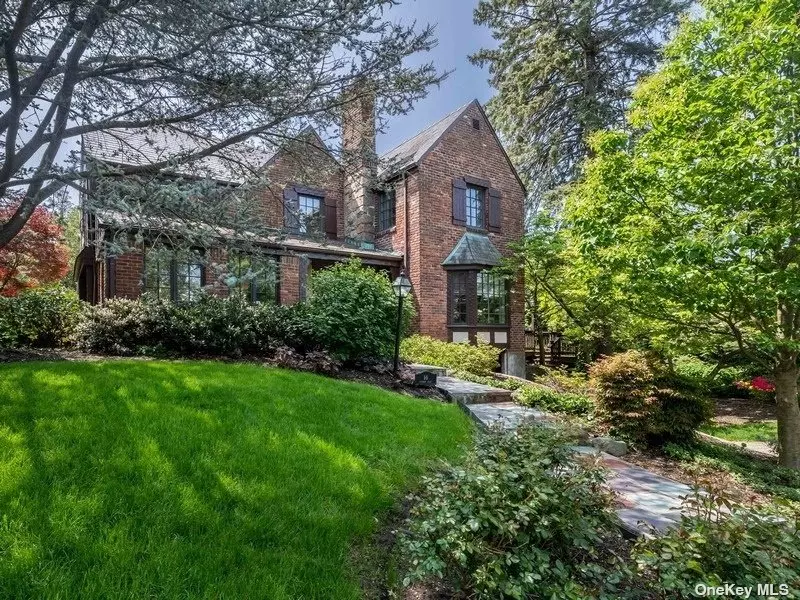 This stately Brick Colonial with slate roof sits on a beautifully landscaped 1/4+ acre (75 x 145). First floor has large primary rooms including living room with fireplace, formal dining room with French doors to deck and gardens, large eat-in kitchen opening to family room and powder room. Second floor has 4 large bedrooms with 2 full baths and walk up attic to bonus room and storage. Gas heat, CAC, new windows, tandem attached 2-car garage and much more.