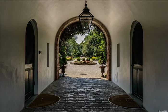 Enchanting pathway to apartment wing & stables