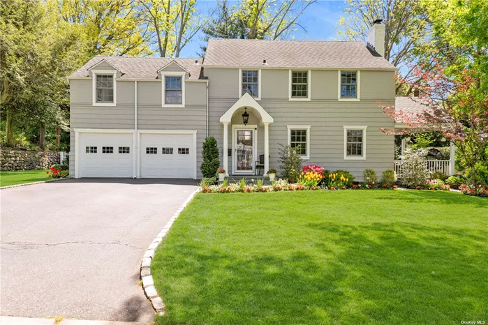 Beautiful Colonial in the Incorporated Village of Plandome Heights, Manhasset. 4 well sized bedrooms and 2.5 marble baths. Primary bedroom with cathedral ceiling and skylights. Modern kitchen with Silestone countertops and stainless steel appliances. Sunny large bonus room off of the kitchen with plenty of windows. Charming dining room with an abundance of natural light. Living room with wood burning fireplace with access to charming side porch. Beautifully landscaped backyard with mature plantings and oversized brick patio, perfect for entertaining 2 zone heating and central air (CAC 2yrs old) Close to LIRR, highways, hospitals, restaurants and the Americana Shopping Center.