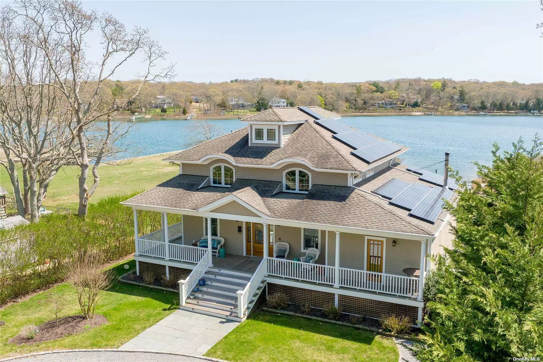 Set on a half acre, this custom-built boat-lover&rsquo;s home features a private dock and expansive views of Peconic Bay. Nearly every room in this shingle-style traditional home is showered with aqua blue light from the Bay, while framing beautiful views across to Robin&rsquo;s Island. Large windows light up every room with endless views, flanked by the custom kitchen, large pantry and light-filled breakfast/dining room on one side, and the richly-lite family room with wood burning stove on the other. A half bath, den with adjoining full bath finish off the ground floor level. The second-level owner&rsquo;s suite, featuring breathtaking views from every angle and luxurious, spa-like bathroom. Two guest bedroom, full bath and laundry room finish off this level. The magnificent back deck and lavish plantings make this outdoor space a true oasis and this is complimented by the large outdoor shower. The setting and views are unparalleled.
