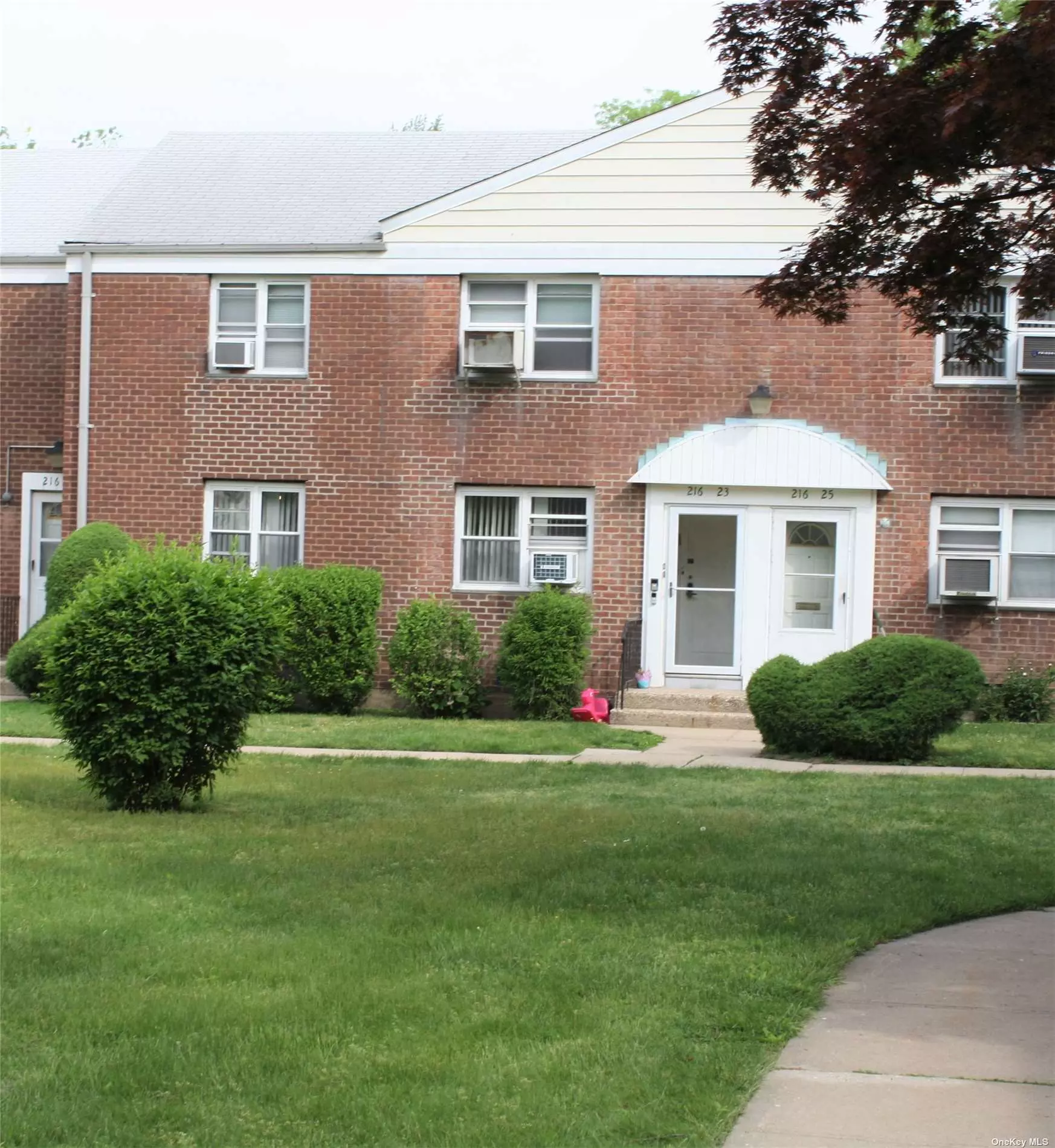 Very charming first floor 2 bedroom coop, located in a park like setting, near everything. Hardwood floors restored in November 2023. Living room, kitchen and hallway painted in November 2023. Very Large eat in kitchen, 2 large bedrooms each with large closets, full bathroom, 3 year old washer and dryer, lots of windows letting in natural sunlight. This unit is located in a courtyard so there is a special feeling the erases all thoughts of being in the city. Tress, landscaping, birds chirping, and sun greet you each day. Yet the apartment is a half block from Bell Blvd, express bus service to Manhattan and local buses, stores are steps away, short walk to schools, restaurants, and shopping . The coop offers a playground and laundry room that you will not need, because you have a washer and dryer in your unit. Low monthly maintenance that includes gas. It is a wonderful place to live, and much better than paying rent. Coop permits 10% down. No pets except service and emotional support animals. No subletting.