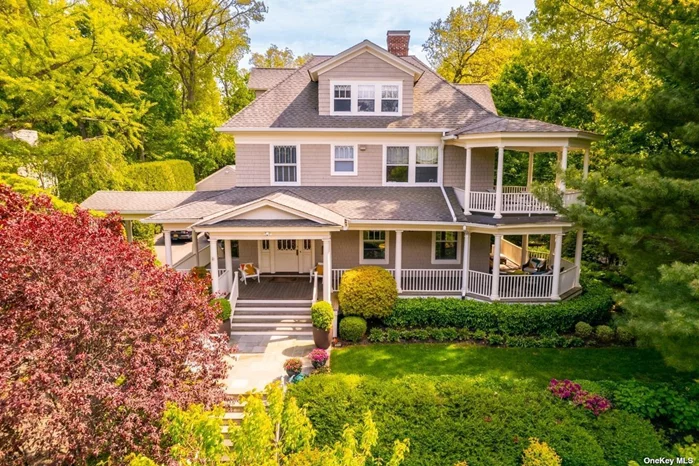 Dreams Do Come True - This Port Washington Height&rsquo;s home is truly a once-in-a-lifetime home. Perfectly sited on a private third-of-an-acre rise on one of Port&rsquo;s loveliest streets in the historic district. Generously proportioned in all ways; wide stone entry, leads to dramatic deep wrap-around Ipe covered porch - completely rebuilt to current standards. 10&rsquo; ceilings in the large entry foyer/stair hall, exquisite oversized cathedral paned windows and French doors greet you at every turn in the elegant living and dining rooms. Three fireplaces, 4 bedrooms on second level; a primary suite with its own covered deck and private bath. 3.5 additional bathrooms all renovated to today&rsquo;s tastes and style. Add to that a dream kitchen with quartz counters, Viking, Subzero Fridge/Wine Fridge and two Bosch dishwashers. The open concept kitchen/soaring great room with 12&rsquo; ceilings leads you swiftly on your way to your exterior entertainer&rsquo;s paradise with hot tub. Add to this a finished third floor with flex space, a double car detached garage, and full walk-out lower level. High ceilings throughout. Grand porte cochere. Too much to describe, this home is not to be missed. Deeded beach rights to keep your paddle board or kayak! Port train direct to Grand Central or the new Penn Station. Taxes in check!