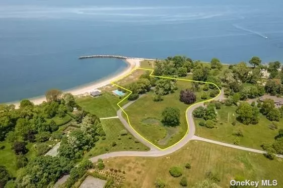 Welcome to Peacock Point ! Once in a lifetime something this magnificent comes to the market. One of the Gold Coasts historic locations overlooking the Long Island Sound has a pedigree dating back to the 1860s when it was farmland for the Peacock Family. This 4.84 direct waterfront lot has approximately 331 feet of frontage on two sides. The stunning original landscape design was commissioned by the Olmstead Brothers and offered broad expanse of lawn to maximize the views. Magnificent and stately trees compliment this vista. This private Association with yearly dues includes the private road and access to a waterfront tea/pool house cabana and pool, private beach and mooring rights. This pristine and magnificent property offers open views of Connecticut and sweeping vistas of water. Imagine the sunsets from this stunning location Also for sale is an additional 4.13 acre parcel next to this property which would make in total a 8.97 waterfront Estate lot. Yearly HOA Dues $6000 per Tax Lot