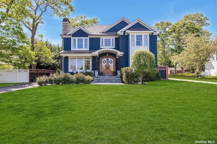 Adorned in deep Indigo Blue, this custom beauty makes a statement in all categories. Flawless top to bottom, architectural accents include an exquisite arched portico and striking black columns with standing seam copper roof, covering the blue stone porch and double leaded glass front door. Inside the raised paneled walls and double height entry set the tone for this impressive yet comfortable home. Flanking the entry is the living room with built-in bookcases and gas fireplace and the formal dining room with intricate tray ceiling. The adjacent butlers pantry with wine refrigerator is perfect for entertaining. The chef&rsquo;s kitchen is truly that, with Sub Zero refrigeration, Wolf 8 burner Range, pot filler, beautifully crowned cabinetry and thick slabs of stone counters. This area offers countertop and table seating for comfortable and causal dining. The family room boasts a shiplapped wall and four paneled sliding glass french doors over looking the yard. A pretty powder room completes this level. Ascend the stairs to the second floor, featuring 3 guest bedrooms, full bathroom, laundry center and a stunning primary suite, with marble surround gas fireplace, full bathroom and walk in closet. The lower level is the perfect recreation area with high ceilings, and full bathroom. Even the detached 2-car garage is a sight with pyramid roof, half round gutters, stacking stone and wood door. It&rsquo;s evident that this turn key home was built with love and care. Don&rsquo;t miss this gem!