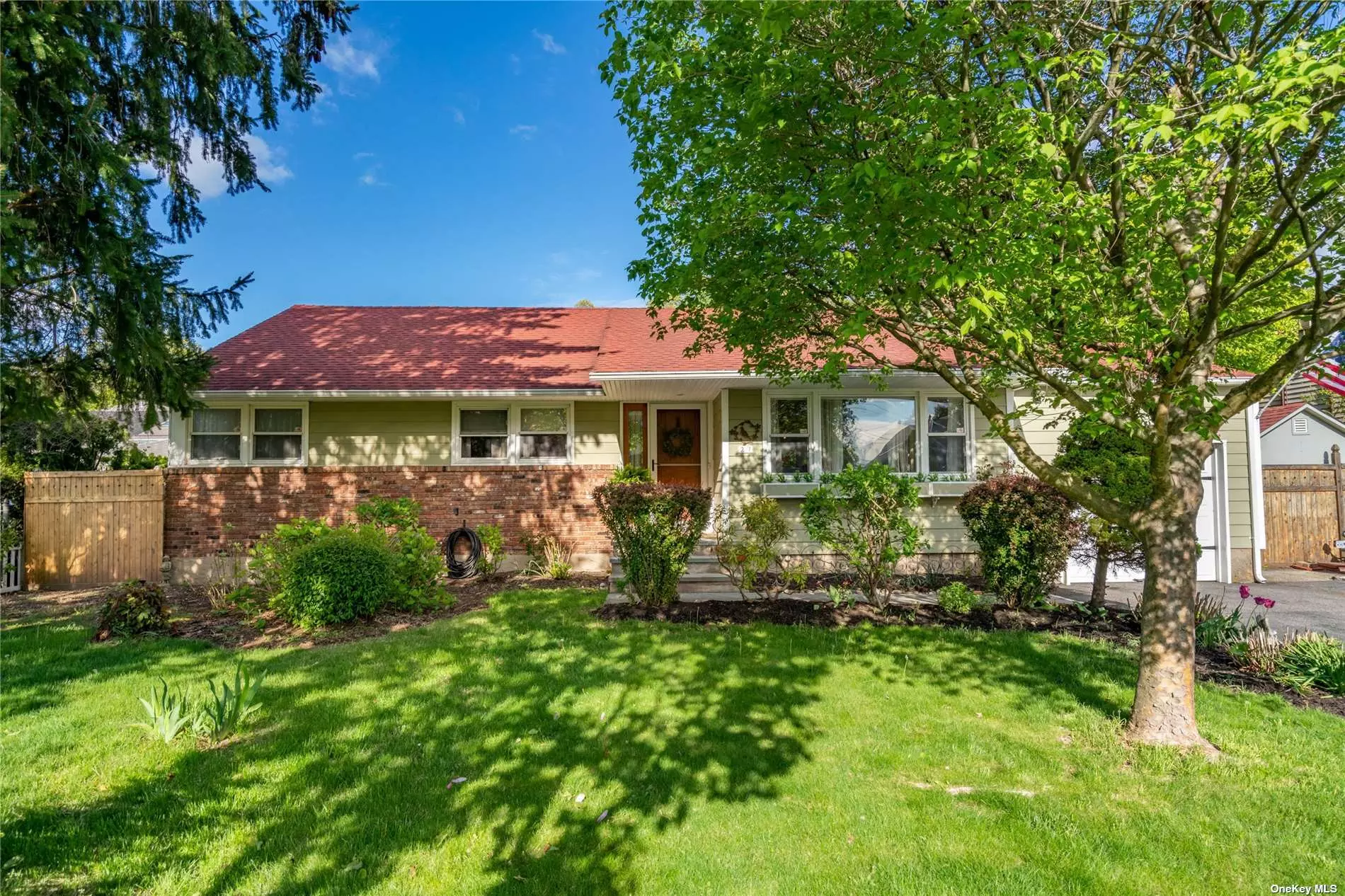 NEW TO MARKET, Welcome to this light filled, charming Ranch. This 3 bedroom, 2 bath home on lovely street in the Roxbury section of Glen Cove, boasts an updated kitchen, huge deck surrounded by specimen plantings and retractable awning-just to name a few of the special features of this home. This gem also offers central air, updated 200 amp electrical service, new hot water heater, Hardie siding, generator and a full finished basement. Glen Cove schools, parks, beaches and golf course. Low taxes! Under $9k!