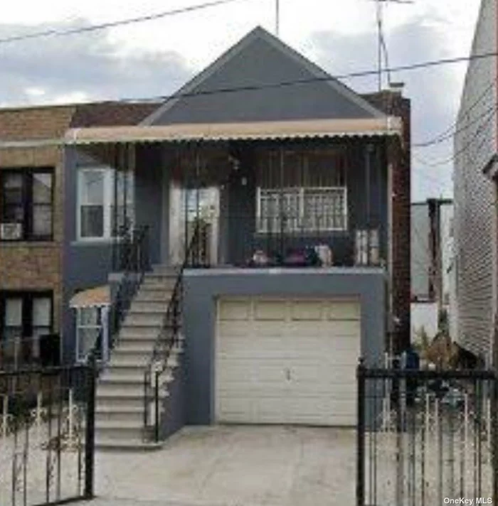 Great Two family home with front balcony has 3 Bedrooms, 2 bathrooms.