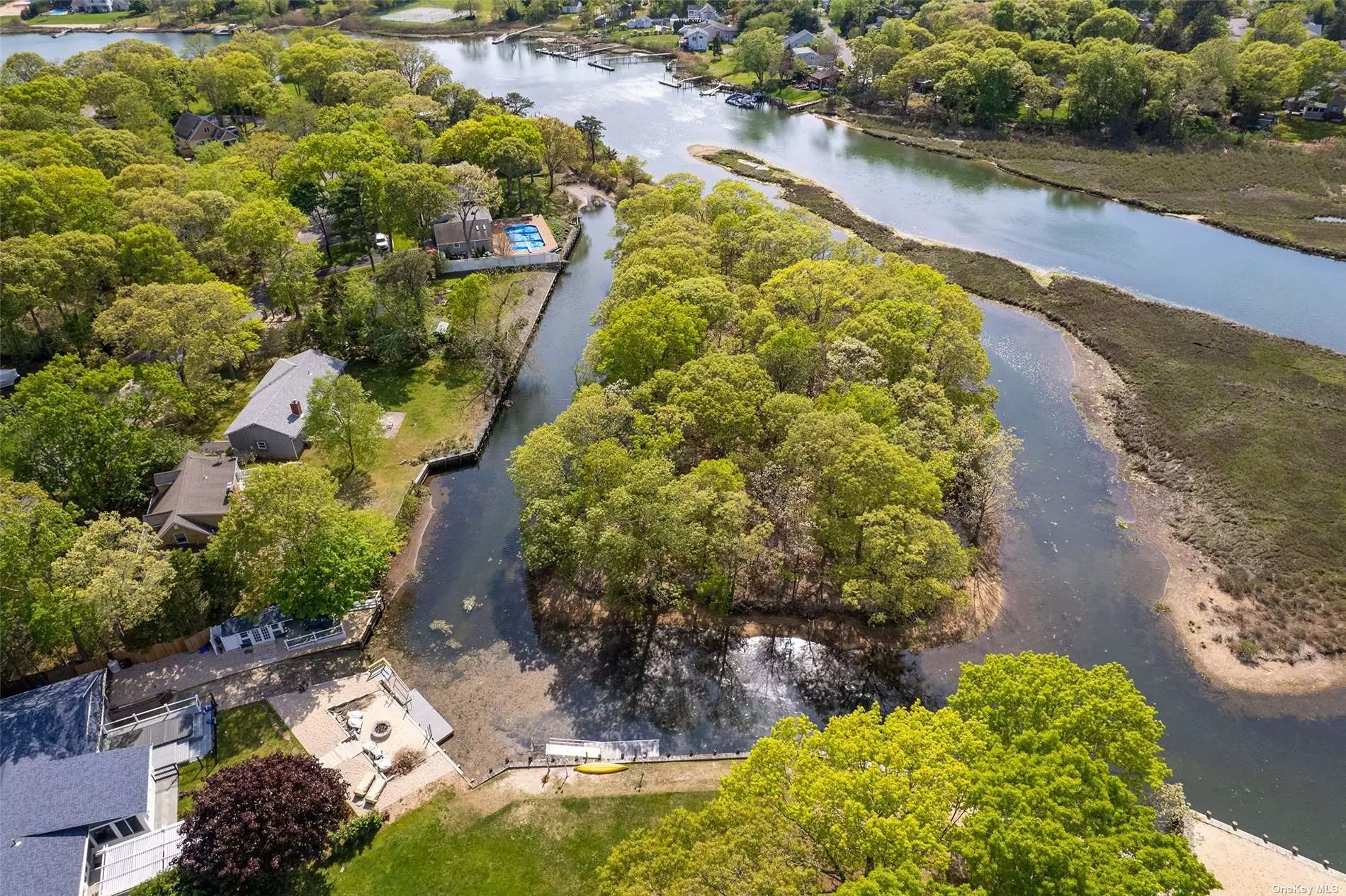 One of the most unique waterfront locations with views through an oak forest. This view is magical during a snow storm when the branches get a coating of white fluffy snow. Short moment to Strong&rsquo;s marine with boat slips around the bend. Home offers wood floors, wood burning fireplace and full basement .Take in the water views from the front door through the dining room. Not located in a flood zone so you can enjoy your waterfront vision!