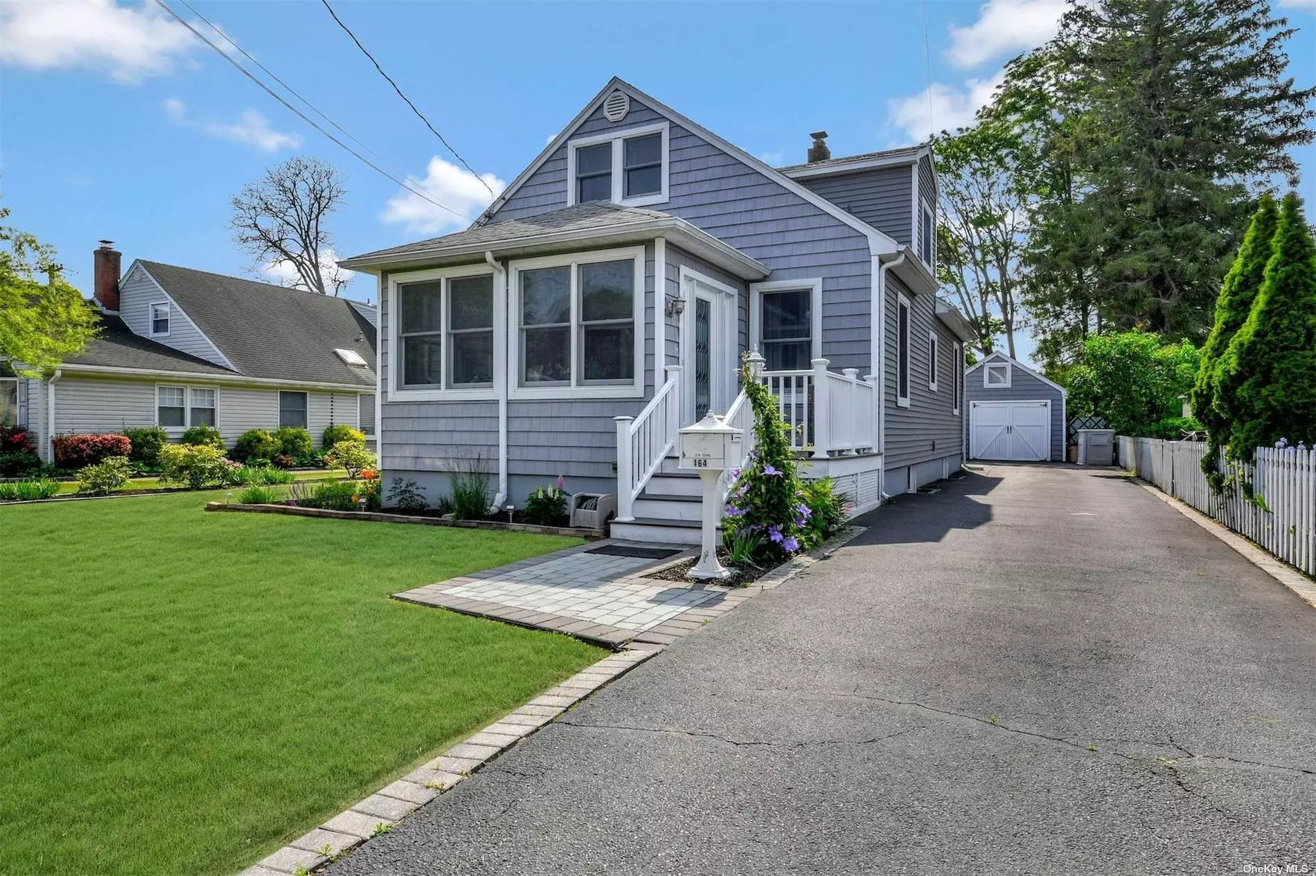 New To Market! Charming Cape Cod Home on Quaint Street, South of Montauk Hwy in Islip. Rich Wood Floors & Living Room with High Ceilings. Pretty Sun Room. Spacious Eat-In-Kitchen with Walk-in Pantry & Gas Cooking. Detached Accessory Structure with Full Bath, possible storage/home office area. Charming Full Bath with Claw Foot Tub. Turn Key Condition and Bursting with Personality! Show & Sell!