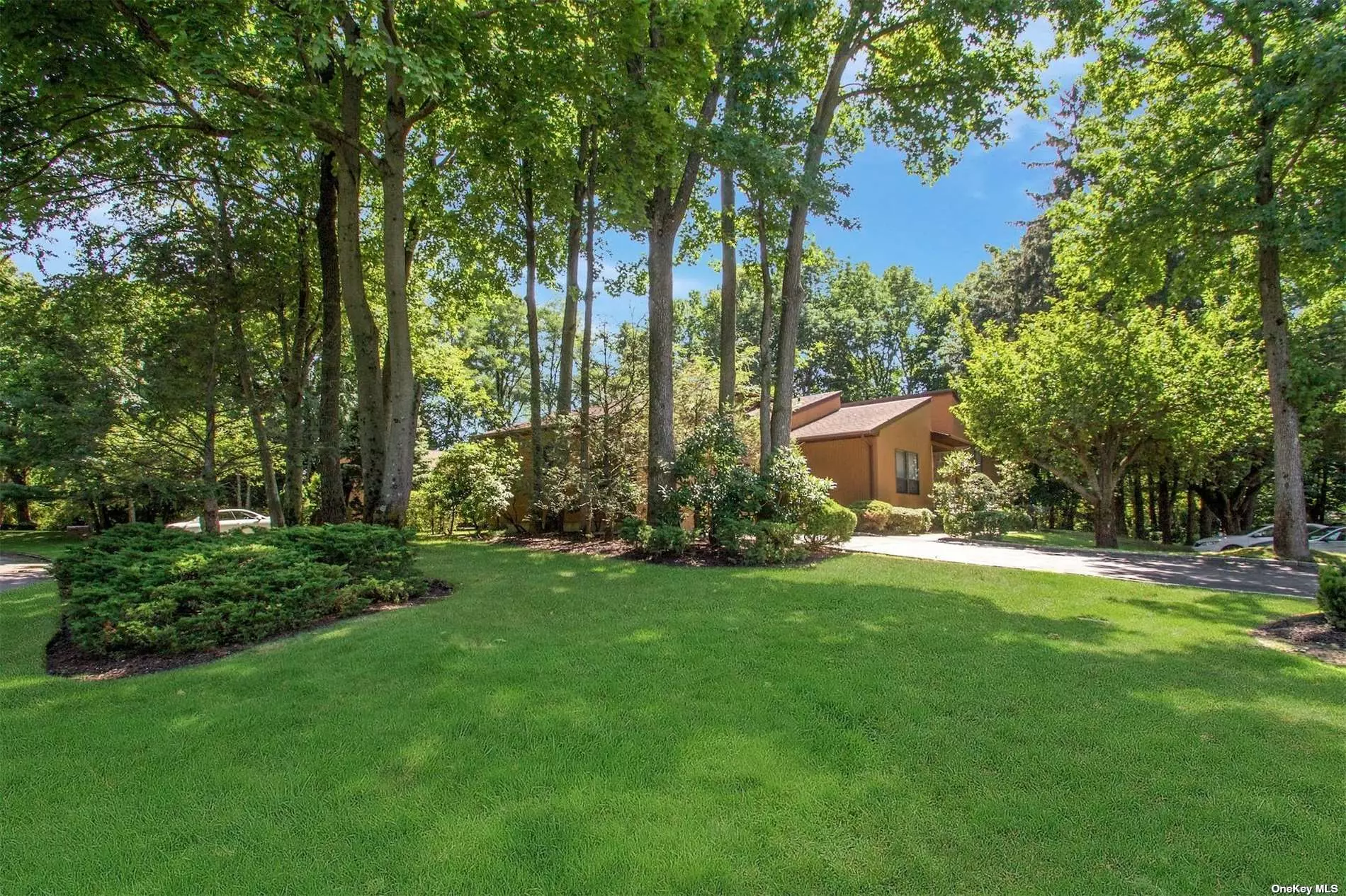 Long driveway leads to the Braemer Model, featuring three Bedrooms and Baths with Primary Suite on the main level. The entry leads to both a Formal Living and separate Dining Room, Kitchen opening to Den with a Greenhouse window. The Primary Suite has doors to the rear patio, two walk-in closets, Dressing Room and full Bath. Up stairs to two additional Bedrooms, Bath and large storage closet. Looking to leave Manhattan and still be close by, this may be for you as it&rsquo;s conveniently located to The Miracle Mile and has shuttle access to the Manhasset RR.