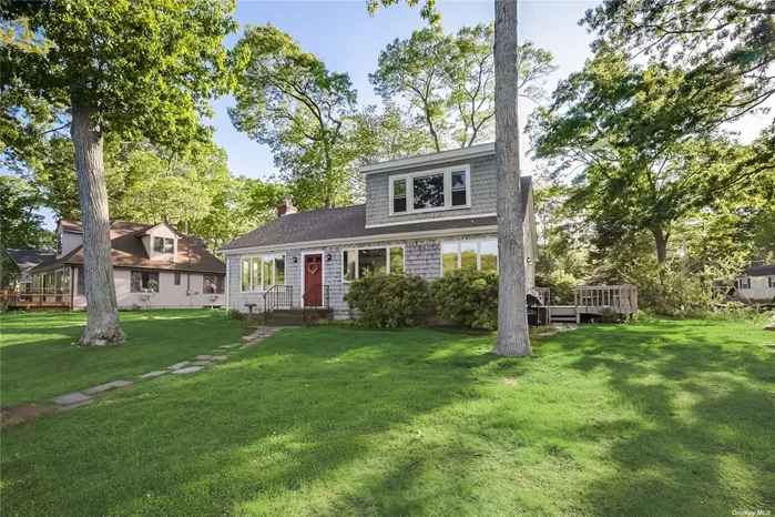 Enjoy the serene and gorgeous water views of this immaculate and spacious home situated on Hashamomuck Pond an inlet off Peconic Bay. This inviting waterfront home features breathtaking water scenery from every room! Filled with natural sun light and beautifully maintained, featuring an updated kitchen with Quartz counter tops, dining room, 2 bedroom suites with bath, a large guest bedroom and bath, hardwood floors and a cozy wood burning fireplace . Enjoy glorious waterfront sunrises, kayaking clamming, and fishing right off your very own dock. Do not spend another day without knowing the tranquility of waterfront living