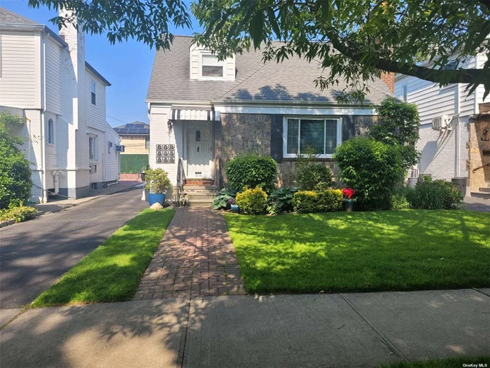 Lovely expanded Cape in the heart of Fresh Meadows. Lovingly maintained, move in ready. This four bedroom plus brick home boasts a fire place, crown molding, solid oak flooring, newer roof, and newer windows. Sprinkler system, front and back. Convenient to Union Turnpike and Cunningham Park. New paver patio in the back yard.