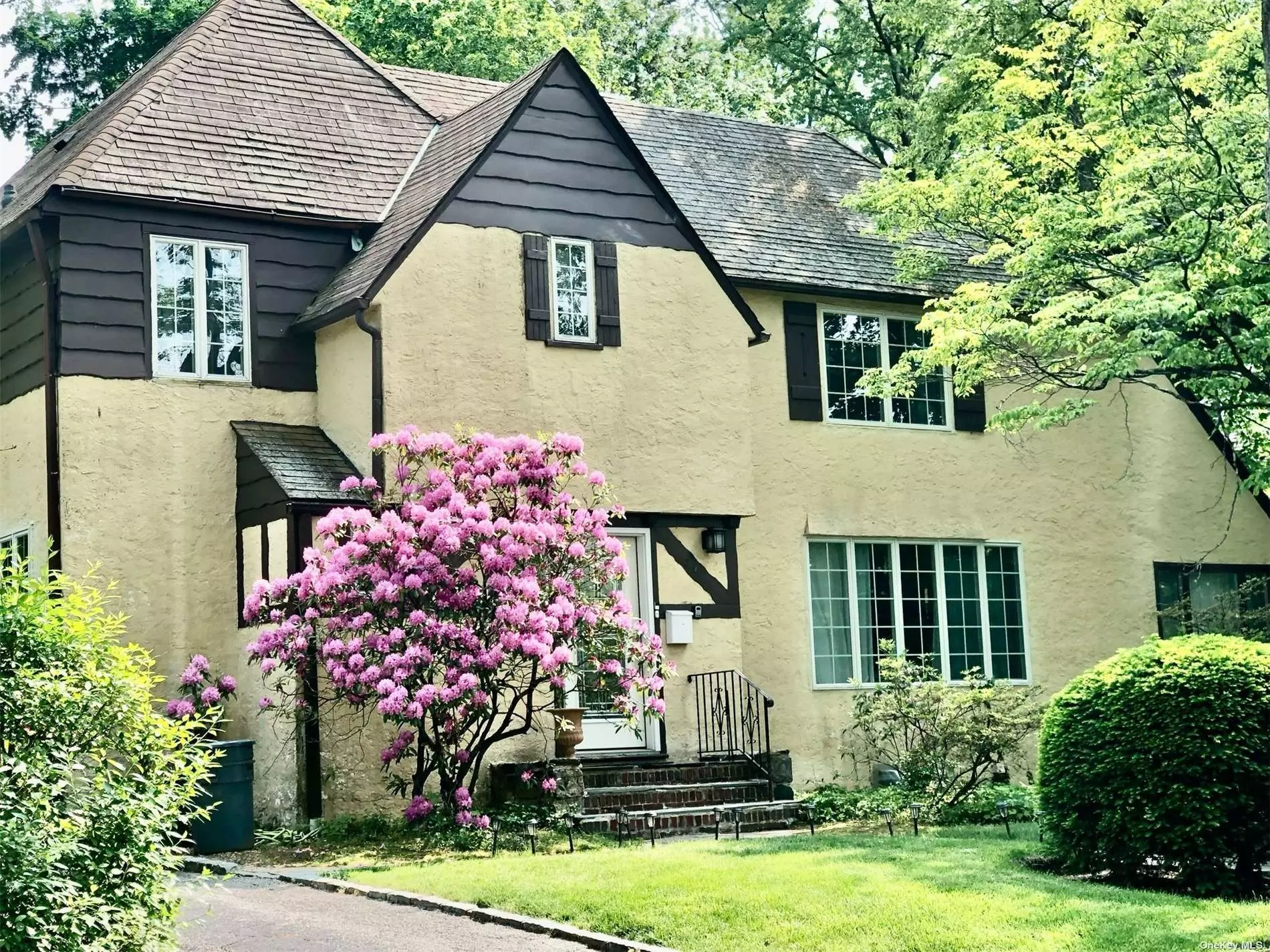 Beautiful Tudor with 5 bedrooms, 3.5 Baths, Large Livingroom, Formal Dining Room, Hard wood floors throughout, Sunroom and Private Driveway. Mins to shops, restaurants and LIRR. Saddle Rock Elementary School, South Middle School. Able to choose North or South for High School. (Buyer should call and confirm with school district for most updated school zoning information).