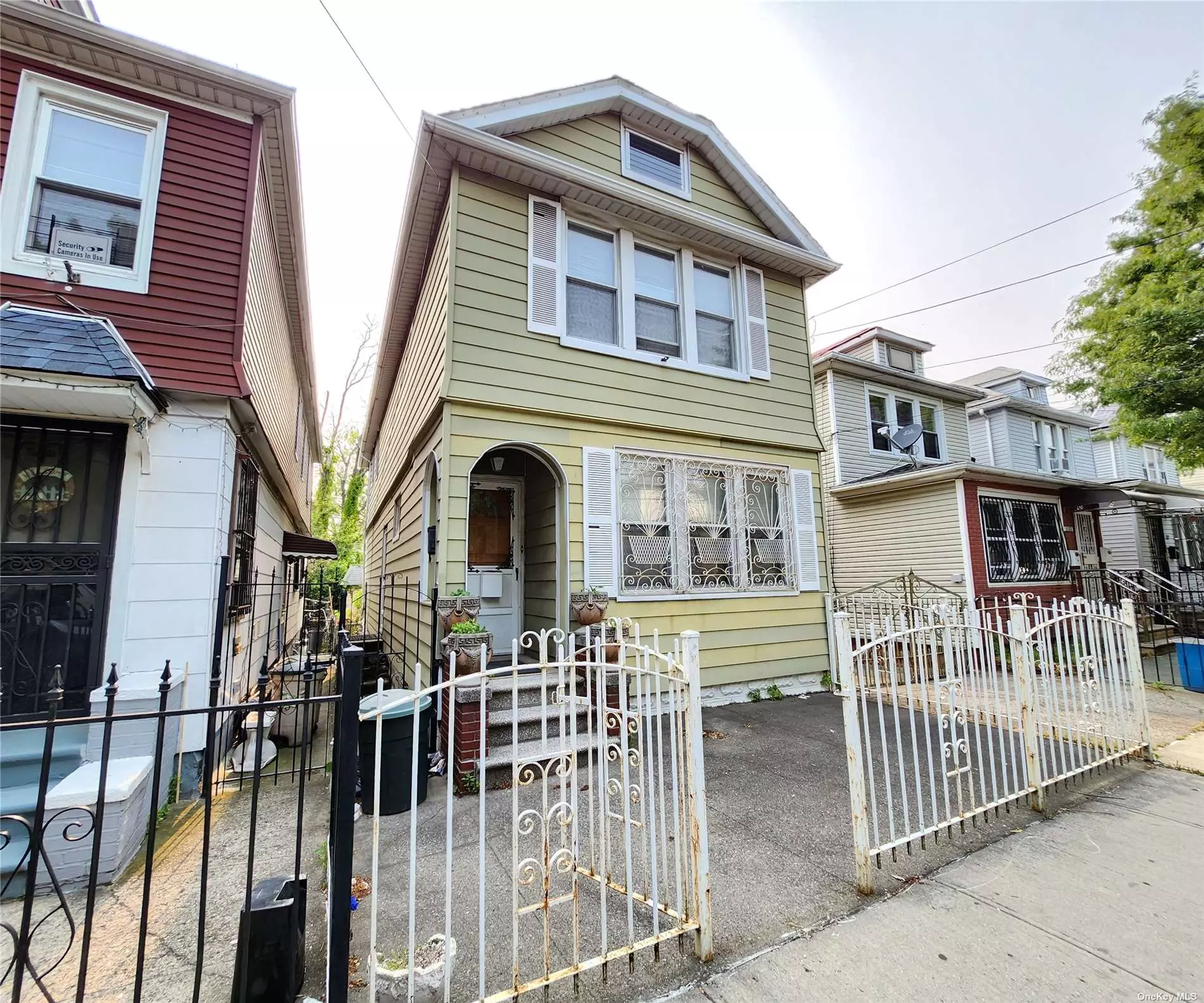 GREAT 2 FAMILY HOUSE 2 GAS METERS, WALKING DISTANCE TO 6 TRAIN AND SHOPS, MAKE THIS HOUSE YOUR OWN WHEN YOU UPDATE THE KITCHEN AND BATHROOMS.... LARGE BASEMENT WITH SEPARATE ENTRANCE. 2 CAR GARAGE.