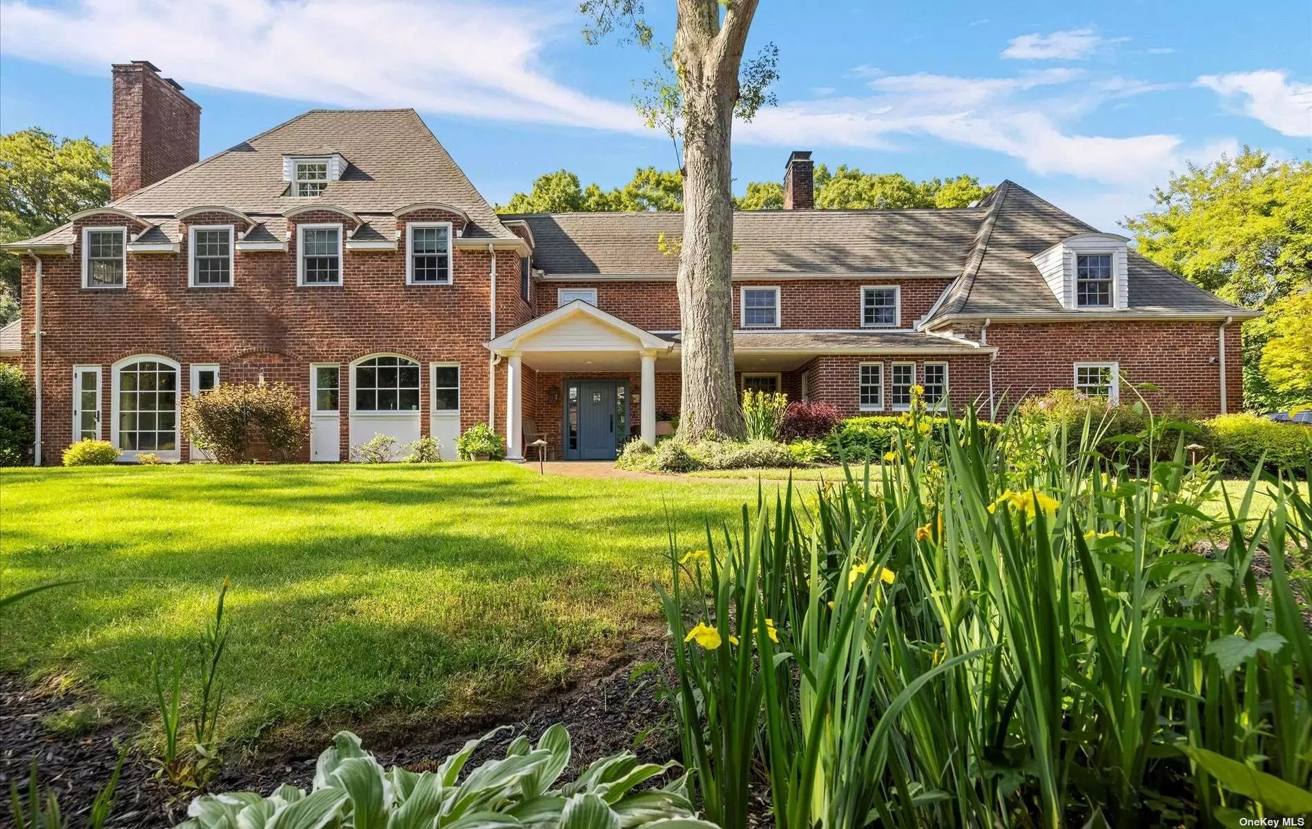 Welcome to this stunning 7-bedroom, 4.5-bathroom brick Colonial. This magnificent property seamlessly blends the charm of yesteryears with the modern amenities of today. Situated on a beautifully landscaped 1.17 acre, this home offers an ideal combination of elegance, comfort, and functionality. Upon entering, you&rsquo;ll be immediately struck by the classic architectural details and the inviting ambiance. The main level boasts an open floor plan, creating a seamless flow between the living spaces. The renovated kitchen, completed in 2017, is a chef&rsquo;s delight, featuring top-of-the-line appliances, ample counter space, and custom cabinetry. Whether you&rsquo;re hosting a large gathering or enjoying a cozy family meal. Adding to the convenience, a mudroom provides a designated space to store coats, shoes, and backpacks, keeping the rest of the house organized and clutter-free. A powder room, also renovated in 2017, is conveniently located on the main level for guests&rsquo; use. The home&rsquo;s charm is enhanced by the timeless brick exterior and the character-filled windows and doors, all of which were replaced, ensuring both aesthetic appeal and energy efficiency. These updates contribute to the home&rsquo;s overall comfort while maintaining its architectural integrity. When it comes to outdoor living, this property truly excels. Step outside to a backyard oasis that features an inground heated gunite pool, perfect for lounging, swimming, or hosting poolside gatherings during the summer months. Additionally, a tennis/pickleball court provides an active and engaging space for recreational enjoyment. Whether you&rsquo;re an avid tennis player or simply enjoy friendly competition, this amenity is sure to impress. For those with multiple vehicles or in need of ample storage space, a 3-car garage offers plenty of room. This feature provides secure parking while also providing additional storage options for seasonal items, sports equipment, or hobbies.