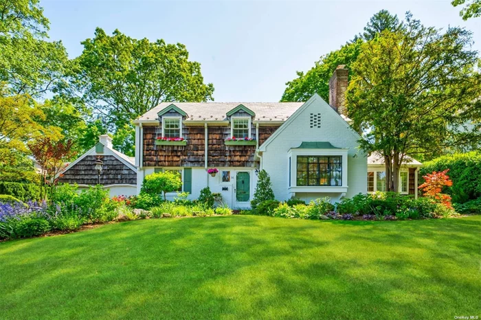 Introducing a timeless and spacious center hall colonial located in the highly sought after neighborhood of Salem, Port Washington that exudes traditional charm and character. As you enter the front door, you&rsquo;ll be greeted by a foyer that leads to a formal living room and dining room on either side. The living room features a wood burning fireplace and a beautiful bay window that allows plenty of natural light to flood the space. Step through to the enclosed sunroom with stunning exposed brick, perfect for relaxing and enjoying a moment of peace. The eat-in kitchen with views of the backyard is ideal for hosting and leads to a large family room fitted with a second wood burning fireplace on one side, and a lovely outdoor patio on the other side perfect for outdoor entertaining. Additionally, the ground floor offers an extra bedroom/office and a full updated bathroom. The beautiful hardwood floors throughout most of the home add warmth and character to each space. Upstairs, you will find a large primary suite and two additional bedrooms with a full bathroom. The home also features a 1 and 1/2 garage, and a full basement. Don&rsquo;t miss out on the opportunity to make this gem your new home!!