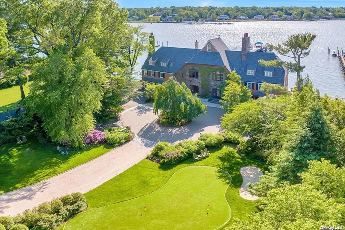 It Is Often A Rare Moment In Time When A Unique One Of A Kind Property Presents Itself As A Very Special Opportunity Not To Be Missed. That Moment Has Arrived. Introducing The Whitney Boathouse Built in 1910 By Architect Christopher Grant Lafarge. The Former Weekend Retreat of John Hay Jock Whitney Offers Over 10, 000 Square Feet Of Pure Luxury. It Is Perfectly Situated On 2.12 Acres, Setting The Majestic Tone Of This Spectacular Arts & Craft Architectural Style Waterfront Estate. Offering Sweeping Waterfront Views, Awe Inspiring Sunsets And Dramatic Entertaining Spaces Which Are Highlighted By An Expansive 53 x 37 Entertainer&rsquo;s Dream Space. Originally Named The Club Room With A 14 Foot Soaring Ceiling, Beautiful Custom Woodwork, Brilliantly Designed With Three Living Room Areas, Two Dining Spaces, A Grand Fireplace, A Bespoke Bar, All Within This Dramatic & Classic Club Room Creating Stylish & Cozy Moments To Be Enjoyed By Family & Friends In This Meticulously Renovated Historic Estate. The Unique 14 Room Private Residence On The Gold Coast Of The North Shore Of Long Island, Restored By Kean Development, Offers A Year Round Luxurious Resort Lifestyle. Three Levels Of Primary Living Spaces With Separate Private Wings Including A Lovely Primary Suite With Fireplace, An Indoor/Outdoor Heated Pool & Spa With Cascading Waterfalls & A Relaxing Lounge, Summer Kitchen & Floor To Ceiling Walls Of Glass Open-Air Doors To Embrace The Serenity On The Waters Edge Experience. A State Of The Art Gym Overlooks Manhasset Bay & All Of Its Splendor. A Gourmet Eat-In Kitchen With Custom French Pine Cabinetry, Butcher Block Island & Marble Countertops Opens Up To The Gorgeous & Mesmerizing Views. One Of The Largest Privately Owned 280ft Docks With A Spacious Waterfront Veranda Which Overlooks The Serene Setting , A Private Beach With Seawall, Multi Level Decks, A Putting Green, Generator, Elevator, Wide Planked Oak Flooring And 2 Bedroom Guest Cottage Are A Few Of The Many Special Amenities Offered In This One Of A Kind Estate. Located In The Sought After Village Of Plandome Manor. Incredible Attention To The Restoration & The Fine Detail In The Interior Design Capture The Essence Of Classic, Timeless Luxury Defined In A True Resort Like Setting & Lifestyle.Close To The Americana For The Finest In Shopping & Dining With Easy Access To New York City & Airports.