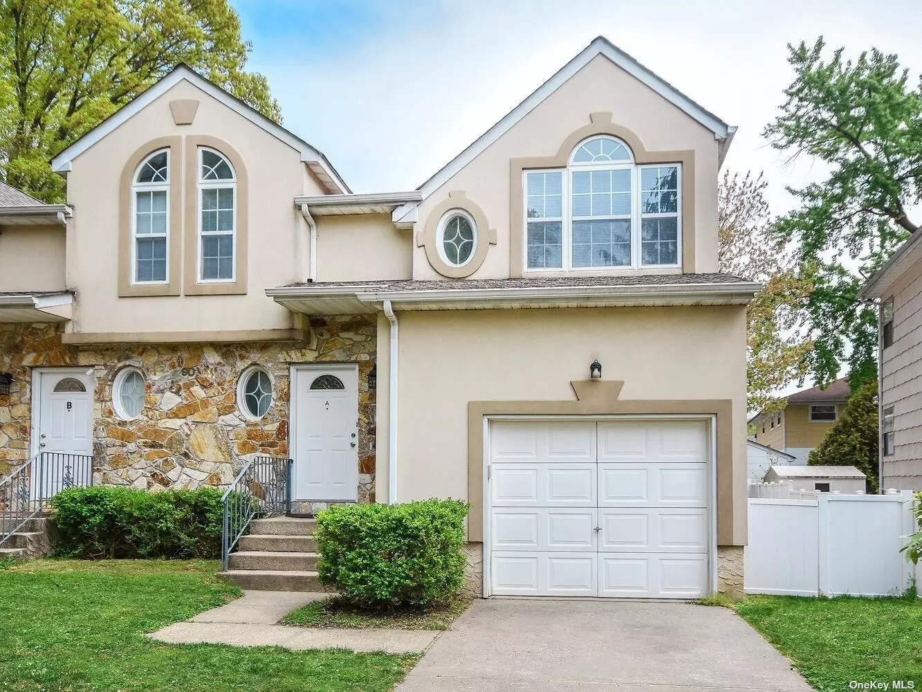 Spacious Duplex w/3 bedrooms, 2.5 baths, beautiful living room w/fireplace, dining room, modern kitchen, and hardwood floors. Laundry in basement. Oversized flat property w/brick patio & garage.