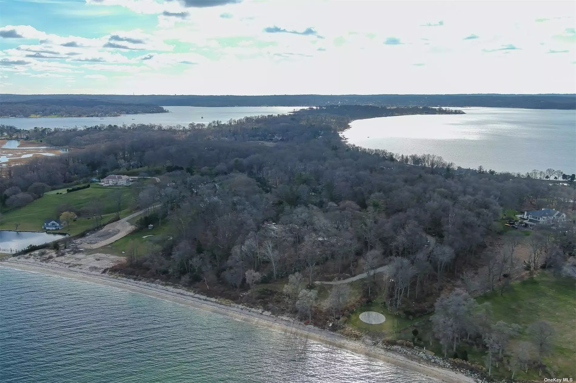 Amazing opportunity to own one of the largest open waterfront parcels on Centre Island with over 564.83 feet of sandy beach. Currently there are four buildings on the property, a main house, pool house, and garage by Ben Thompson of (TAC) and a 2.5 bedroom caretaker&rsquo;s ranch. **All buildings except the caretaker&rsquo;s ranch are in need of a full restoration.** Watch the sunrise over Long Island Sound and the mouth of Oyster Bay from this pristine property. There are many improvements/utilities including public water & electric, dec approved plans for a 200sf boat house. Two ways to access the property from Centre Island Road. Potential for subdivision.