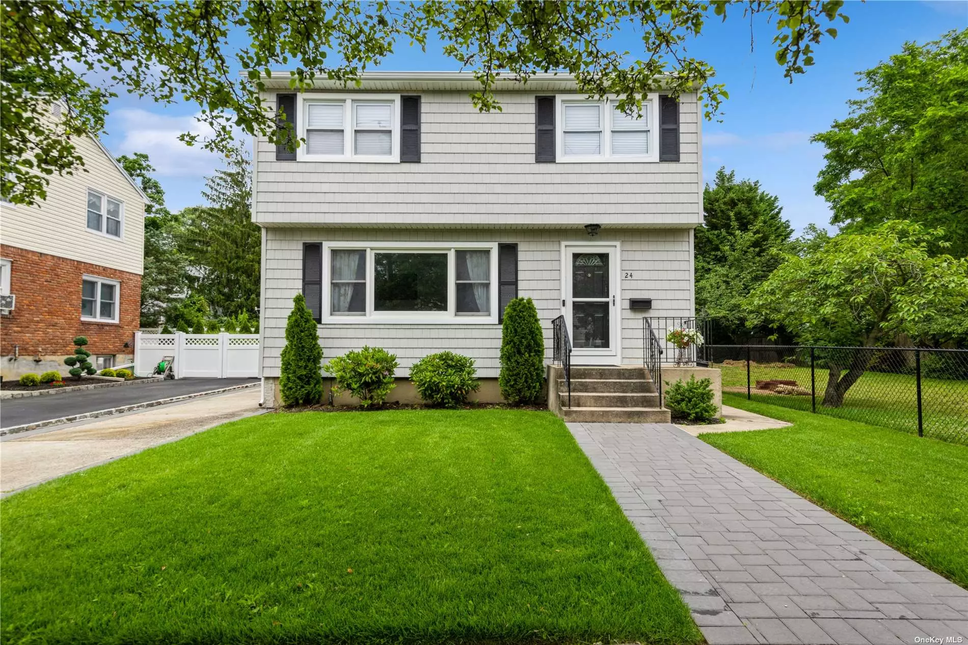 Newly renovated, spacious 3-bedroom, 2 full bath colonial located in the Waterfront Town of Port Washington. A gracious foyer leads you into a sun-flooded living room. The oversized great room has a wood burning fireplace. The large eat-in-kitchen has quartz countertops, stainless steel appliances, ample cabinet space & sliding glass doors leading to the backyard patio. A renovated full bath completes the first floor. The second floor offers 3 generous size bedrooms, a full bath & a new laundry room. Copious closet space and hardwood floors throughout. New high efficiency CAC & heating system. Full Basement. Private fenced and beautifully landscaped backyard. Blocks to Manorhaven Park on the shores of Manhasset Bay. The Park is just shy of 35 acres, with plenty of green space. The Park offers an Olympic-size pool, beach w/kayak & paddle board rentals, boat ramp, 6 tennis courts, paddle tennis courts, baseball fields, basketball courts, playgrounds & More.Blocks to shopping, restaurants & public transportation. The Port Washington Train line is a direct commute to NYC with train service to Penn Station & Grand Central Station. A place to call home.