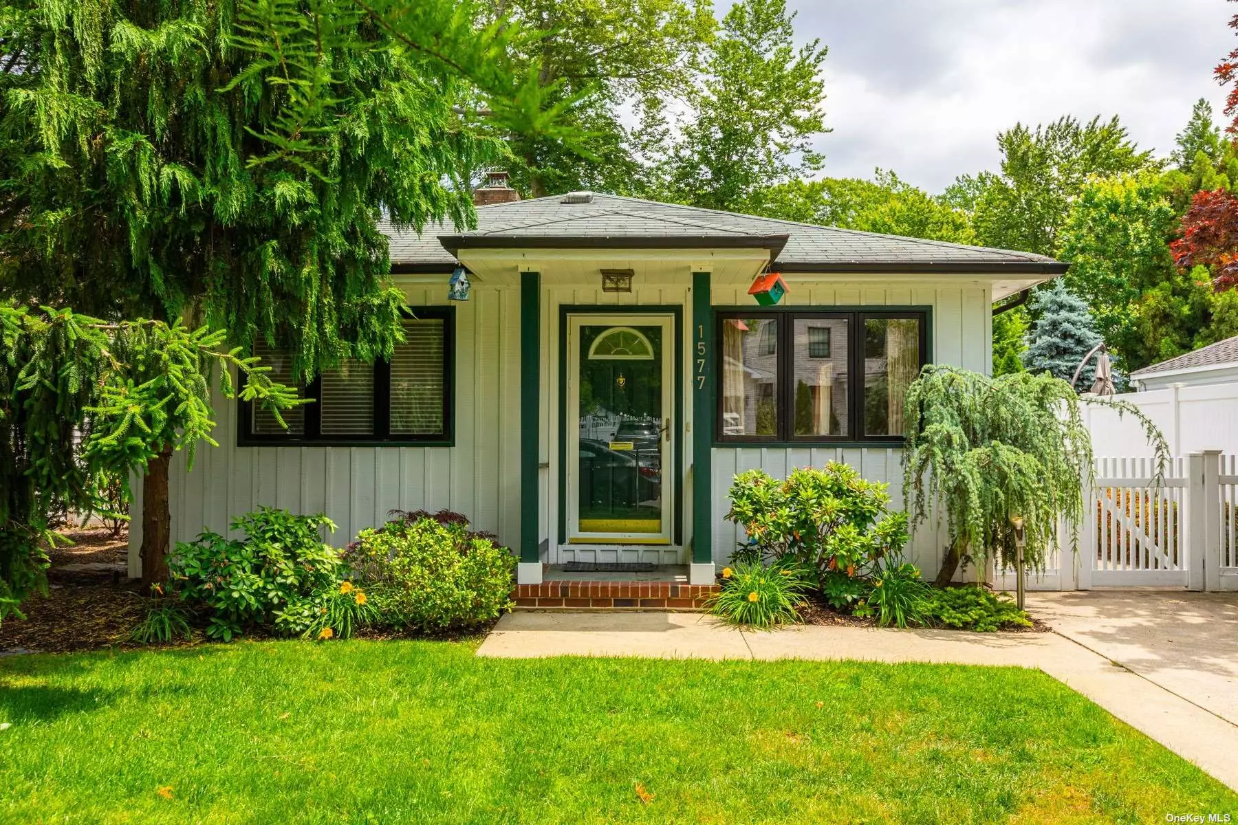 Spacious and Clean 3 Bedroom 3 Bath Ranch in Desirable Wantagh Woods, Featuring Large Bedrooms , Lots of Closet Space and Storage, Wood Floors, Sophisticated and Cozy Den w/fireplace. Full Finished Basement with Outside Entrance. Manicured Landscaping and Private Outdoor Space .