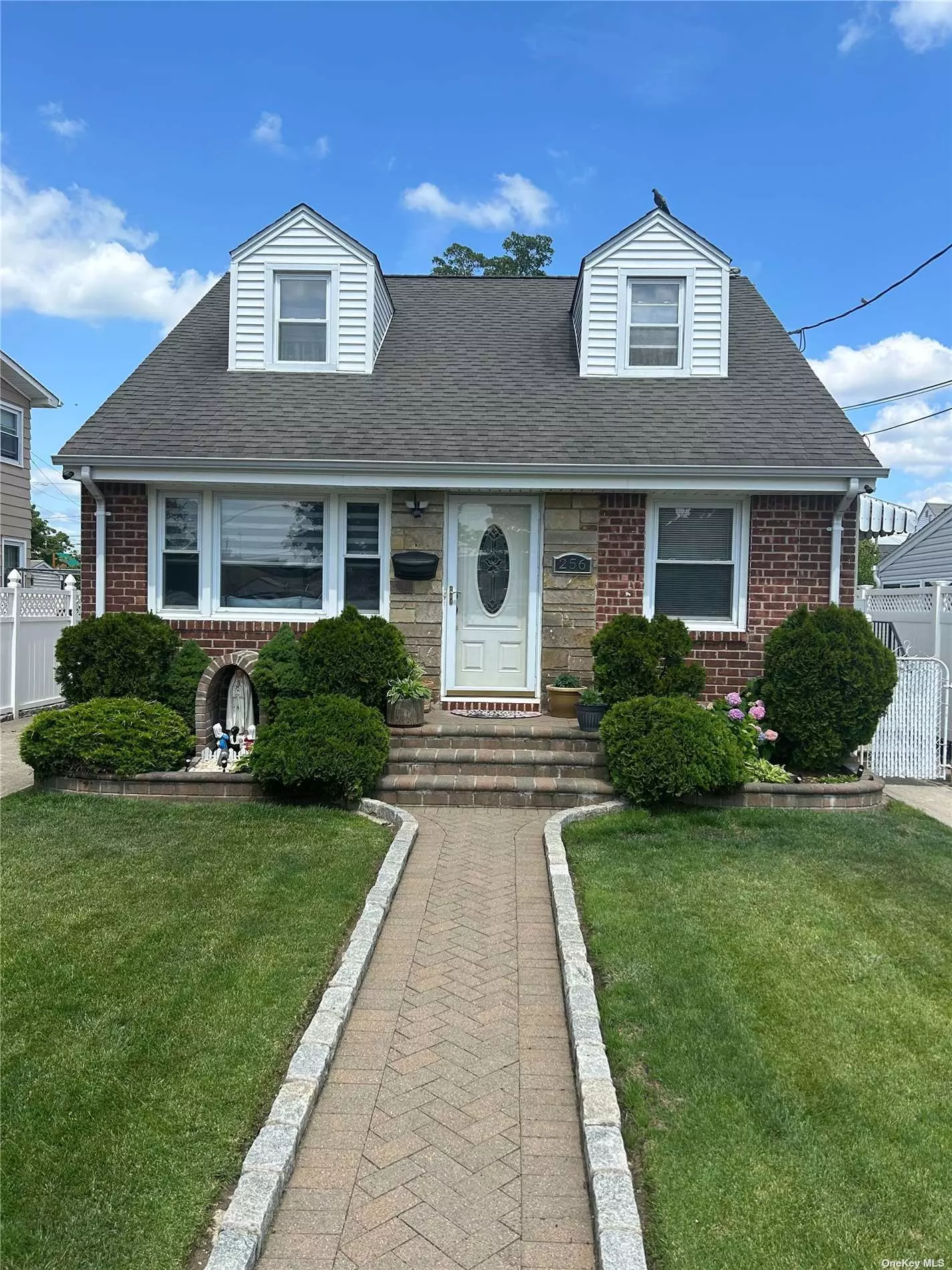 Move in ready Brick Cape featuring updated kitchen and Bathroom. 4 bedrooms. Hardwood floors. Full finished basement with a separate Laundry and Boiler Room. 3 unit Central Air recently installed