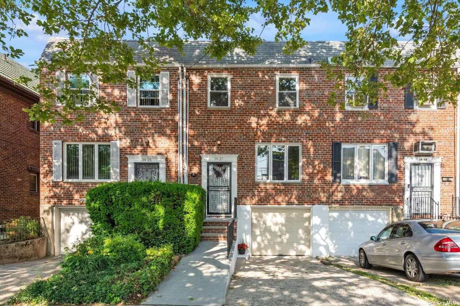 Commuters delight! New on the Market. Solid brick legal one family attached townhouse in move in condition conveniently located one block to the Bayside Village Bell blvd LIRR, culturally enriched dining,  entertainment, shopping, Northern Blvd and major highways. This home is freshly painted and offers refinished hardwood floors through out first and second levels and luxury vinyl tile in the basement. This home offers you three bedrooms, one and one half bathrooms, a Spacious Livingroom, dining room an eat in kitchen, a full finished basement with direct access to landscaped private patio and yard,  a private driveway and garage. This home will not last!