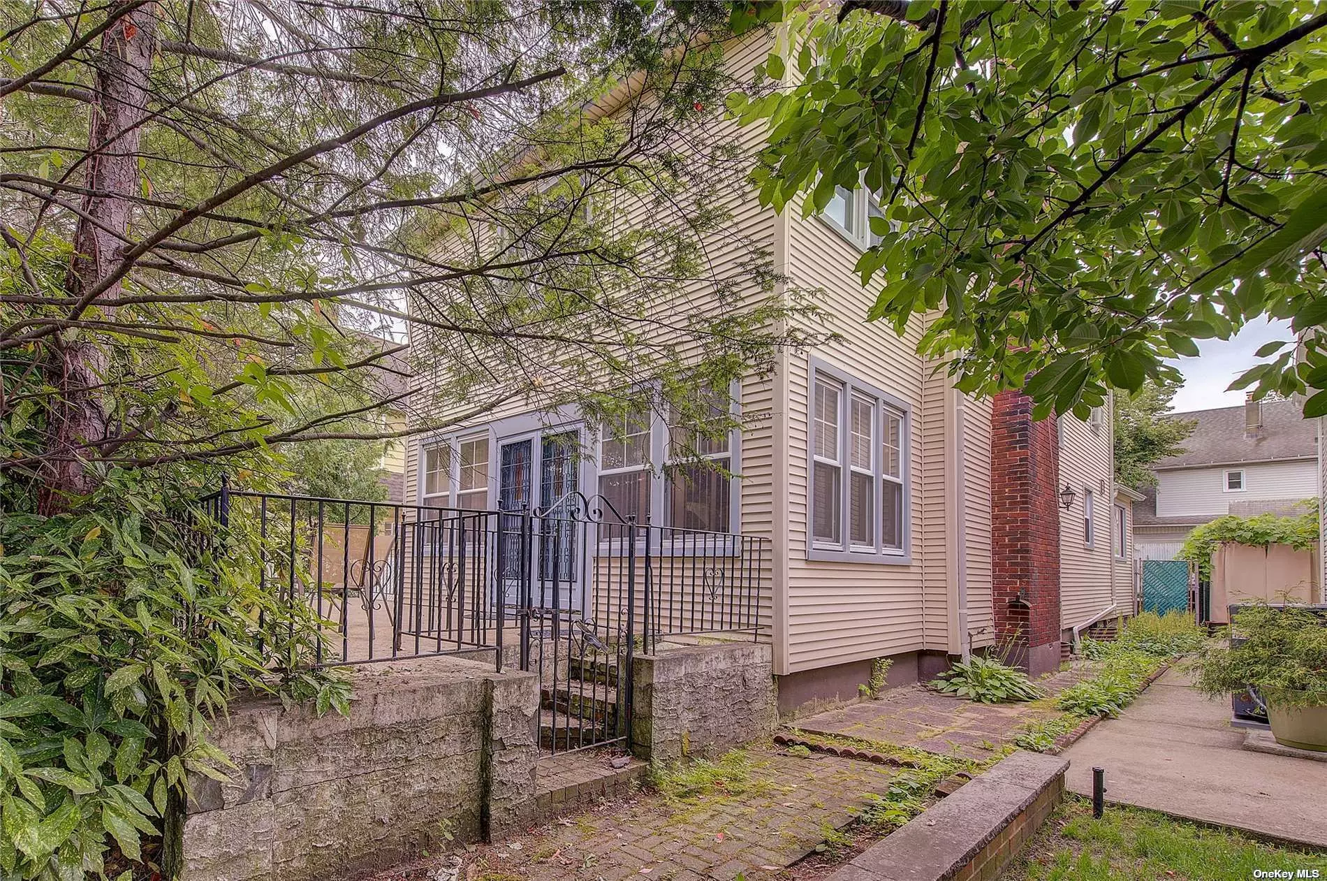 Welcome to this charming colonial located in a Bayside Queens.Situated on a spacious 46.5 x 100 (4, 650sqft) lot, this property offers ample space both inside and out. Step onto the welcoming front porch and enter into your new home. Once inside you&rsquo;ll be greeted by a generously sized living room adorned with a beautiful brick fireplace, truly giving the room great character. Adjacent to the living room is a generously-sized formal dining room, providing more than enough space to accommodate a full dining set along with additional pieces you may want to add such as china cabinets, buffets, etc. Additionally, the eat-in kitchen offers a convenient and comfortable space for preparing and enjoying meals. Moving to the second floor, you&rsquo;ll discover a large master bedroom featuring an en-suite bathroom. Two additional bedrooms and another full bathroom complete this level, providing ample space for everyone. In addition, there is a walk-up attic with two rooms, providing additional versatile space that can be utilized as per your specific needs. The finished basement offers additional versatility, presenting an opportunity for a recreation room, home office, or any other desired use. Outside, an above-ground swimming pool awaits, though its condition is not guaranteed. For those with vehicles or storage needs, a detached one-car garage is included as well. Convenience is a key highlight of this property, as it is convenient to the Clearview Expressway, just 6.5 blocks away from the LIRR, providing easy access to Manhattan within a short 30-minute commute. Moreover, being close to both Bell Blvd and Northern Blvd, you&rsquo;ll find a wide array of dining and entertainment options. SOLD AS IS.