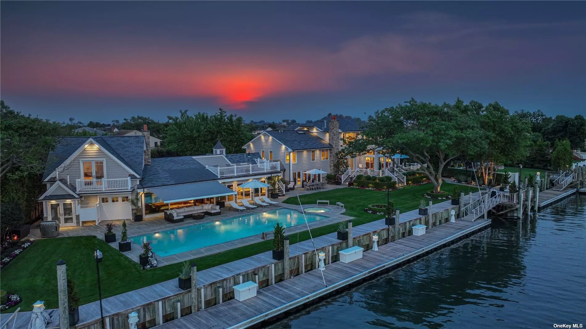 Experience the epitome of luxury living with this spectacular new listing in a coveted Bayfront location. Situated on a double lot, this exquisite property offers breathtaking water views and the idyllic Hamptons lifestyle, all within an easy commute. This architectural masterpiece boasts a grand total of six bedrooms and six bathrooms, providing ample space for both relaxation and entertainment. Step inside to discover a meticulously designed home that caters to your every desire. Indulge in the ultimate outdoor oasis, featuring an in-ground pool with a jacuzzi, perfect for unwinding and enjoying the sun-drenched days. A 140&rsquo; floating dock provides direct access to the water that will accommodate your yacht and is 3 minutes ride to the ocean, allowing you to embark on aquatic adventures or simply take in the serene waterfront scenery. Inside, the luxury continues with a state-of-the-art home theater, where you can immerse yourself in cinematic experiences from the comfort of your own private retreat. The property also includes a private guest suite, ensuring that your visitors experience the same level of opulence and comfort as you do. Entertain with style in the expansive living spaces, seamlessly blending indoor and outdoor living. The indoor and outdoor speakers create a harmonious ambiance throughout, whether you&rsquo;re hosting a soir?e or simply relaxing with loved ones. Wake up to awe-inspiring vistas from the master suite, designed to provide a serene sanctuary. The breathtaking water views and luxurious amenities offer the perfect setting to start your day in pure bliss. Immerse yourself in the sought-after Hamptons lifestyle without sacrificing convenience. With an easy commute, you can enjoy the tranquility of waterfront living while still maintaining access to the vibrant city. This is your chance to own a slice of paradise that combines extraordinary beauty, luxurious amenities, and unparalleled views. Don&rsquo;t miss out on this incredible opportunity to embrace the waterfront lifestyle you&rsquo;ve always dreamed of. Live Epically, Live on the Bay!