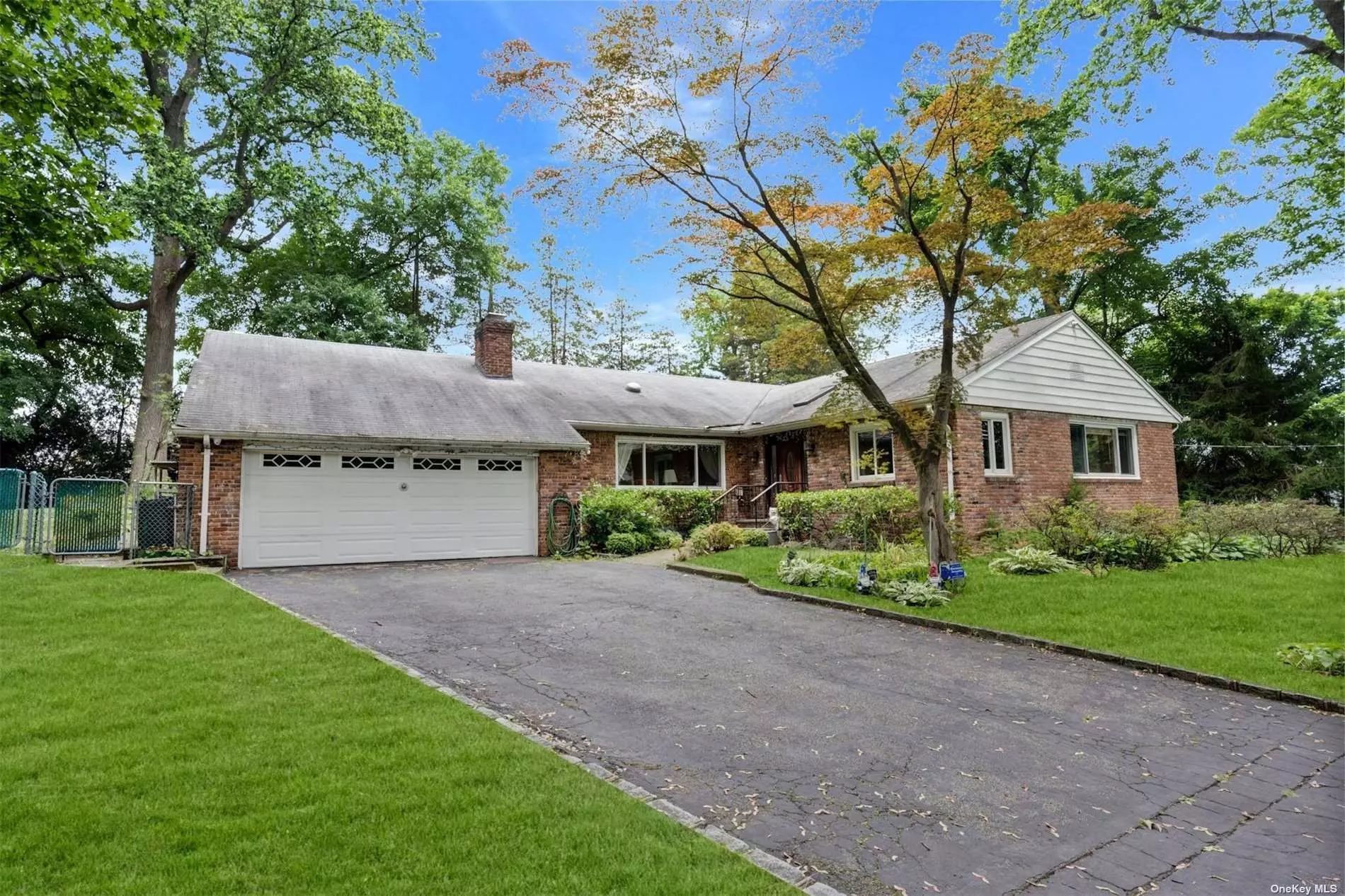 A Must See! Great Location! This Ranch-style home features a large Eat-in Kitchen, and a beautiful formal Dining Room with sliding doors, skylights, and stained glass windows. A formal Living Room with a wood-burning fireplace. A primary bedroom with an ensuite bathroom, walk-in closet, and extra closet space, also sliding doors to a private deck. 2 Bedrooms, and an office, Full Bath. Hardwood floors throughout. A partially finished basement with a Recreation room, Den, Utilities, Laundry room, Walk-In Cedar closet, and plenty of storage space. A walk-up Attic. A 2-car attached garage with pull-down stairs to storage. Sold As-Is.