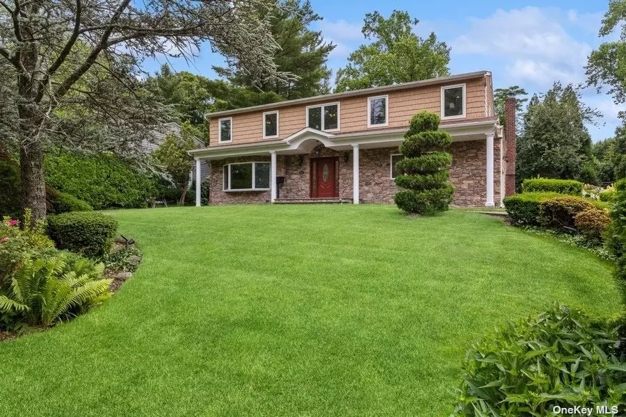 Perfectly situated mid-block on a quiet tree-lined street in the heart of the Flower Hill section of Roslyn, this beautiful 5 bedroom, 3.5 bath colonial was expanded and completely renovated throughout. The home features a spacious living room with large bay windows, an elegant formal dining room, a sun-drenched family room with a fireplace, and an expansive gourmet kitchen with skylights, beautiful cabinetry, Cambria quartz countertops, a walk-in pantry, radiant-heated floor, sizable island, top of the line appliances, and a spacious sitting area. A powder room and a mud/laundry room with access to the side yard, backyard, and 2-car garage complete the first floor.The second floor boasts a spacious primary bedroom suite with 2 walk-in closets and a beautiful bathroom and there are 4 additional nicely sized bedrooms that are serviced by 2 beautiful full bathrooms. All the bathrooms boast Cambria quartz countertops, custom cabinetry with plenty of storage, and radiant heated floors. The full basement offers an abundant amount of recreational and storage space. The professionally landscaped grounds that is fully fenced, with in-ground sprinklers, Cambridge paving stone patio, and a Timbertech deck with the BBQ connected to the gas line provides a private tranquil retreat that makes entertaining a delight. The home was expanded and completely renovated in 2016 including the roof, Marvin windows, vinyl cedar shake siding, stone facade, boiler, central air conditioning, electric upgrade and all new wiring/ethernet, plumbing, kitchen, bathrooms, whole house generator, deck, patio, fencing and it is connected to the sewer system.The home is in the desired Roslyn school district and qualifies for the Port Washington LIRR train sticker. The location, size and overall condition make this the perfect place to call home!