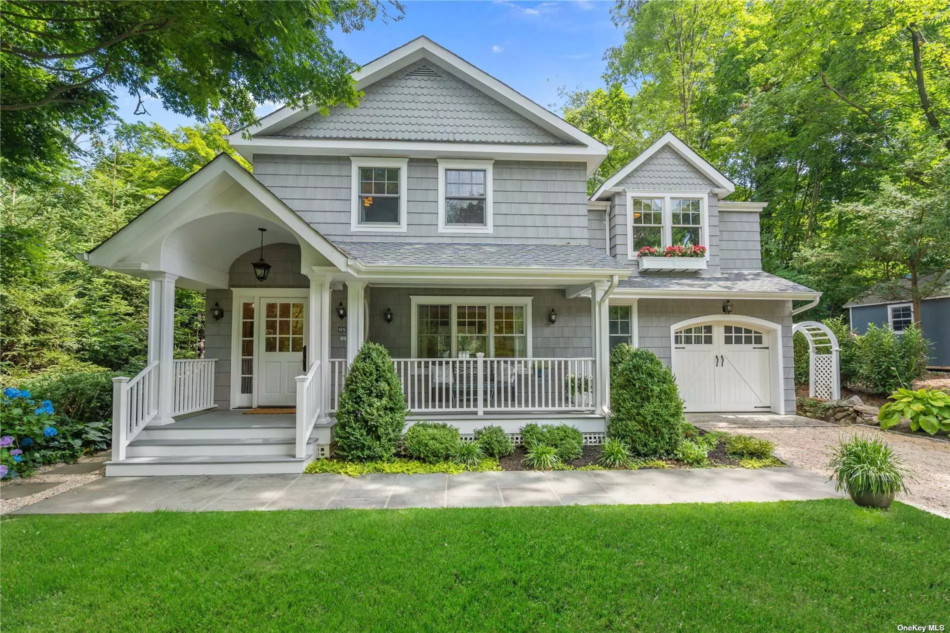 This delightful and sunlit home has undergone a comprehensive redesign, including 2 renovations, resulting in a remarkable transformation. The skilled architect utilized a portion of the garage area and repositioned 12 walls, effectively expanding and enhancing the proportions of every room. Notable additions include a charming front porch, a convenient half-bath, and a laundry/mud room, access to 1.5-car garage on the first floor. Furthermore, the electrical, plumbing, and windows have been updated throughout, and a new HVAC system (2-zone CAC & 2-zone heat) and a gas fireplace have been installed for easy comfort. Both the Primary Bath and the full Bath in hall on the second floor have also been tastefully remodeled. In the secluded backyard, a newly constructed retaining wall and beautifully designed landscaping create a perfect oasis for enjoying intimate dinners and quality entertaining with friends. Ideally situated just two blocks away from the Harbor, this home also boasts close proximity to the Sea Cliff village center, offering an array of quaint restaurants and shops. Part of award-winning North Shore School District.