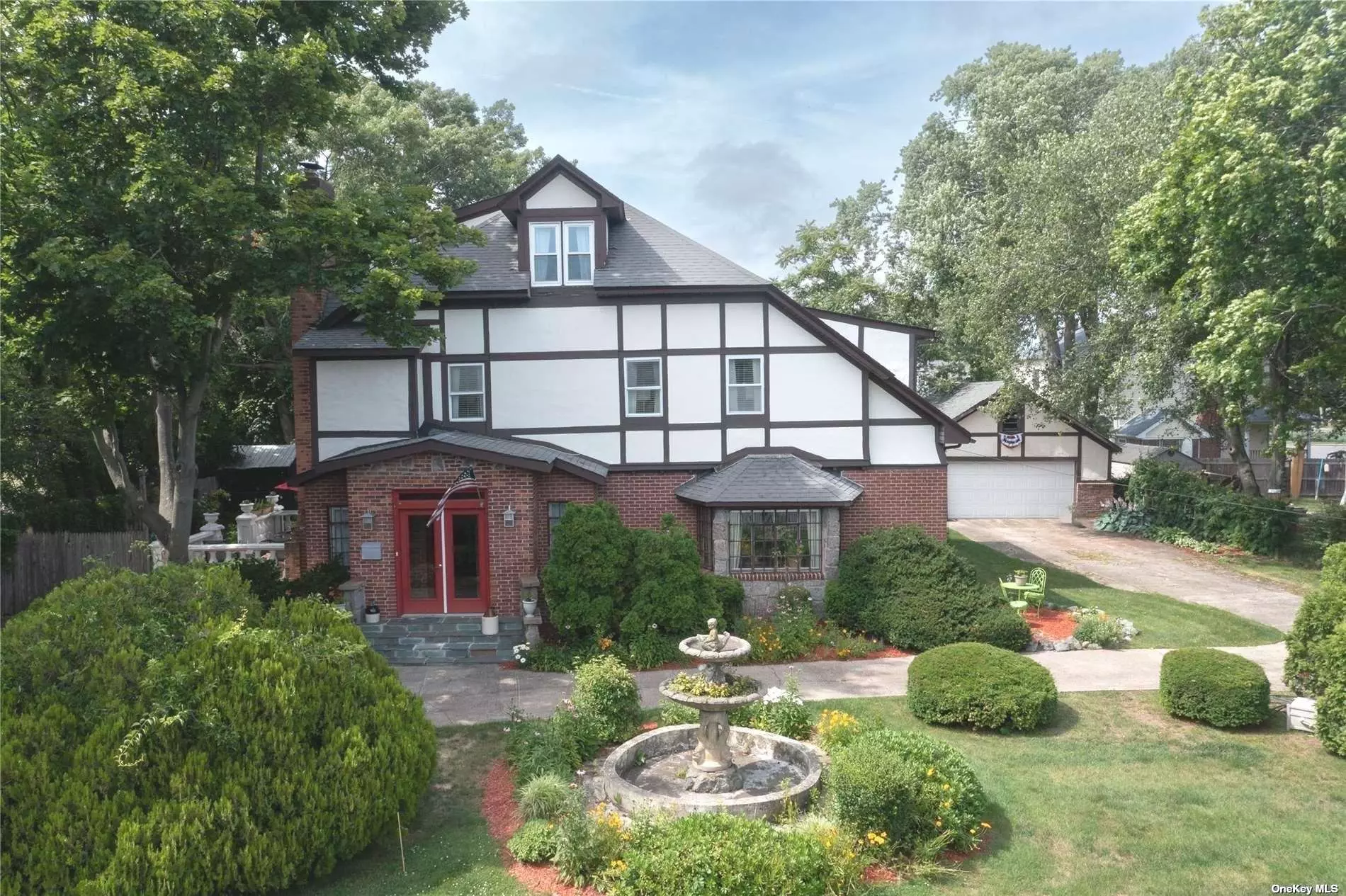 A circular driveway and beautiful manicured grounds lead you to this beautiful Tudor style home. With close to 4500 square feet of living space this gorgeous 3-level Tudor was built in the 1890&rsquo;s which was formally a part of the Arnold Estate. When entering, you are greeted by the Grand Foyer with fireplace. The main level consists of a formal living room, den, office, kitchen, formal dining room and half bath. 2nd floor has primary EnSuite w/sitting area, 3 additional bedrooms, full bath & laundry room. The finished 3rd level offers an amazing overflow of living space with a bedroom, 2nd office, playroom/ media room & full bath. Throughout the home there are welcoming spots to curl up and relax as well as quiet places to escape for work. Convenient to schools, restaurants, parks, SOHO Country Club and Golf Course, Robert Moses beaches and a ferry ride away from the Fire Island Shores!