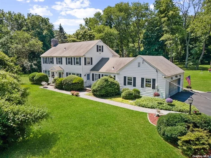 Welcome to this prestigious property located in the charming village of Old Brookville. Situated on a breathtaking 2.58-acre lot, this 3, 200 square foot colonial offers a serene and picturesque setting. Upon entering, you are greeted by a welcoming entry foyer that sets the tone for the elegance and comfort found throughout the home. The main level boasts a formal living room with a cozy fireplace, perfect for intimate gatherings. Adjacent to the living room, a gorgeous sunroom invites abundant natural light, creating a tranquil space for relaxation and enjoying the surrounding beauty. For formal occasions, a spacious dining room awaits, providing an ideal backdrop for hosting memorable dinners. The eat-in kitchen features a charming breakfast nook, offering a delightful space to start your day while overlooking the scenic landscape. Additionally, the main level includes a versatile area with a separate entrance, which can be utilized as guest quarters, a home office, or simply as extra living space to suit your needs. Ascending to the second floor, you will find the master bedroom, complete with a walk-in closet and a private master bath, providing a peaceful retreat. Three additional bedrooms offer ample space for family members or guests, accompanied by a full hallway bath. The full basement of this property encompasses a large laundry and storage area, ensuring convenience and functionality. Furthermore, a generously sized recreational room presents the perfect opportunity for entertainment, leisure activities, or creating a home gym. This home has been meticulously maintained, reflecting its clean and neat condition. The beautiful hardwood floors throughout the home add warmth and character, complementing the traditional colonial charm. A two-car garage provides convenient parking, while a patio overlooks the expansive backyard, inviting you to unwind and enjoy the natural surroundings. Don&rsquo;t miss the chance to make this well-kept gem your own, offering endless possibilities to create your dream home in the sought-after village of Old Brookville.