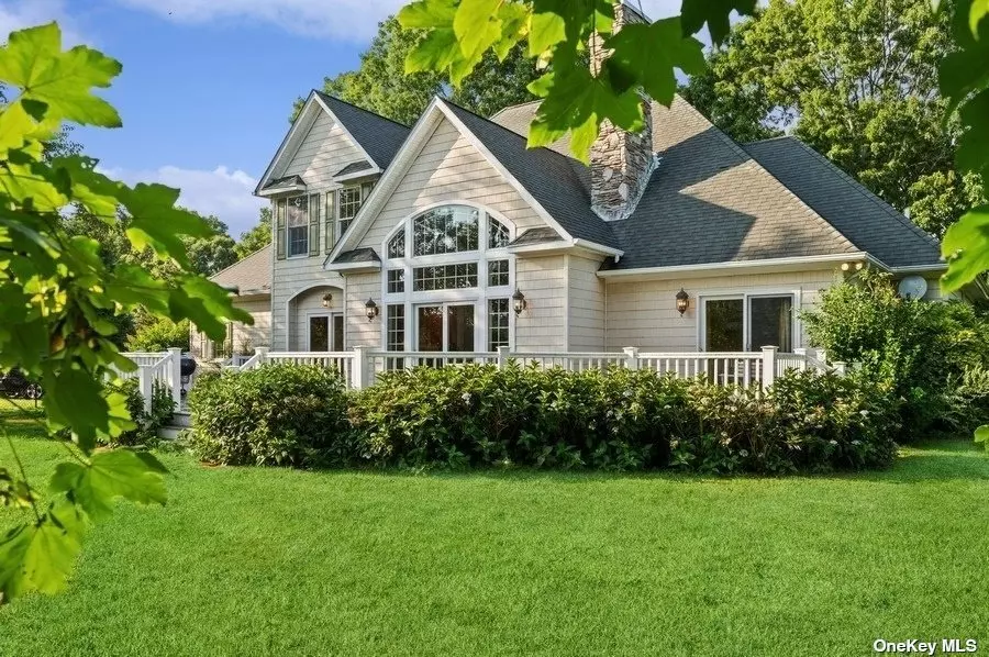 A Bright and Beautiful Post-Modern Home in the Heart of Cutchogue on the Coveted North Fork of Long Island. Situated on .91 of an Acre of Property with Plenty of Room for a Pool. The Sun-Drenched Home is Over 3000 Sq Ft of Living Space with 3 Bedrooms and 2.5 Baths. An Impressive Foyer and Staircase Welcomes You Upon Entry. The First Floor Features a Stately Private Office with 19th Century Double Doors, a Massive Great Room with Wood Burning Fireplace, a Primary Bedroom Suite with Marble Bath Including 2 Walk-In Closets, Formal Dining Room, Kitchen, and Laundry. The Second Floor Features 2 Additional Bedrooms, Full Bath, a Sky-lit Finished Room with Additional Stairway Access Down to Kitchen and Laundry. There is an Unfinished Space for Storage or Future Living Space. The Home has 9ft Ceilings and Hardwood Floors throughout, a New Propane Fired Heating System, New On-Demand Hot Water, New Decking, Freshly Painted, Central Air. Fenced Rear Yard. Oversized 2.5 Car Garage. Full Unfinished Basement. Irrigation. Public Water. There is Bay Beach Access within the Neighborhood. In Very Close Proximity to Town, Shoppes, Restaurants, Marina, Golf, Vineyards and More!