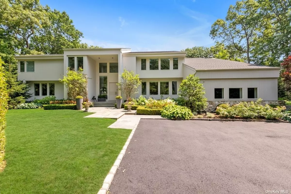 Located in the Prestigious Tall Oaks Community in Oyster Bay Cove, This beautiful Post Modern home has been renovated in 2019 to perfection and features all the luxury amenities you could dream of. Two recently professionally landscaped acres, backing the Fox Hollow Preserve. Very tranquil, private location. Enter through The Grand Double Entry Foyer To Enjoy The Main Floor Which Features Incredible Ambiance While Offering Many Expansive Areas To Relax, Dine And To Entertain. Open Floor Plan with an Abundance of Natural Sunlight, Spacious rooms, Vaulted High Ceilings, Floor to Ceiling Windows, Amazing Formal Living room and Beautiful Formal Dining room. The Chef&rsquo;s Kitchen has many luxury amenities including imported custom European Cabinetry, Calacatta Gold Countertops, Subzero fridge, freezer, full size wine cooler, Miele Dishwasher, Miele built in Coffee maker, Wolf appliances (double oven built-in microwave, gas range top). New Kitchen Sliding Doors open to the patio . It&rsquo;s an entertainer&rsquo;s dream. Plenty of space for dining al fresco or simply relaxing in nature. Home Office, Laundry Room, Powder Room complete the first floor. Vaulted ceilings and 9ft ceilings throughout. Master Suite with two spacious walk in closets. Master Bath is all in white Carrera marble with floating walnut double vanity and free standing NOKORI LED therapy tub with Dornbracht Faucets. plus 3 bedrooms and 2 additional baths, with a bonus room complete the 2nd floor. Radiant Heated floors in all bathrooms on 2nd floor. 3 Car Garage, full Lush Acres. Centrally located, near train, schools, dining, shopping, and beaches. CSH Schools.