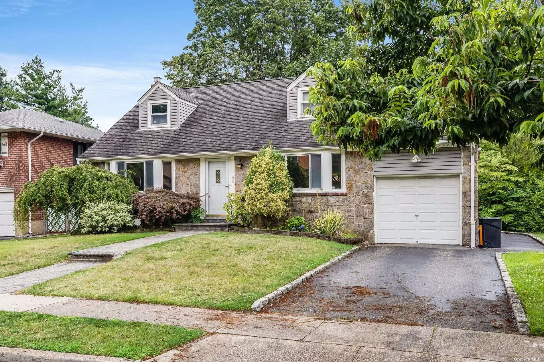 Lovely single-family Cape Cod detached house in prime Jericho area. Over 1500 sq. ft. of living space with 4 bedrooms and 2 full baths. Hardwood floors throughout. Private driveway with a 1-car attached Garage. Central AC and Gas heat. Close to LIRR, Schools, Shops, and Parks.