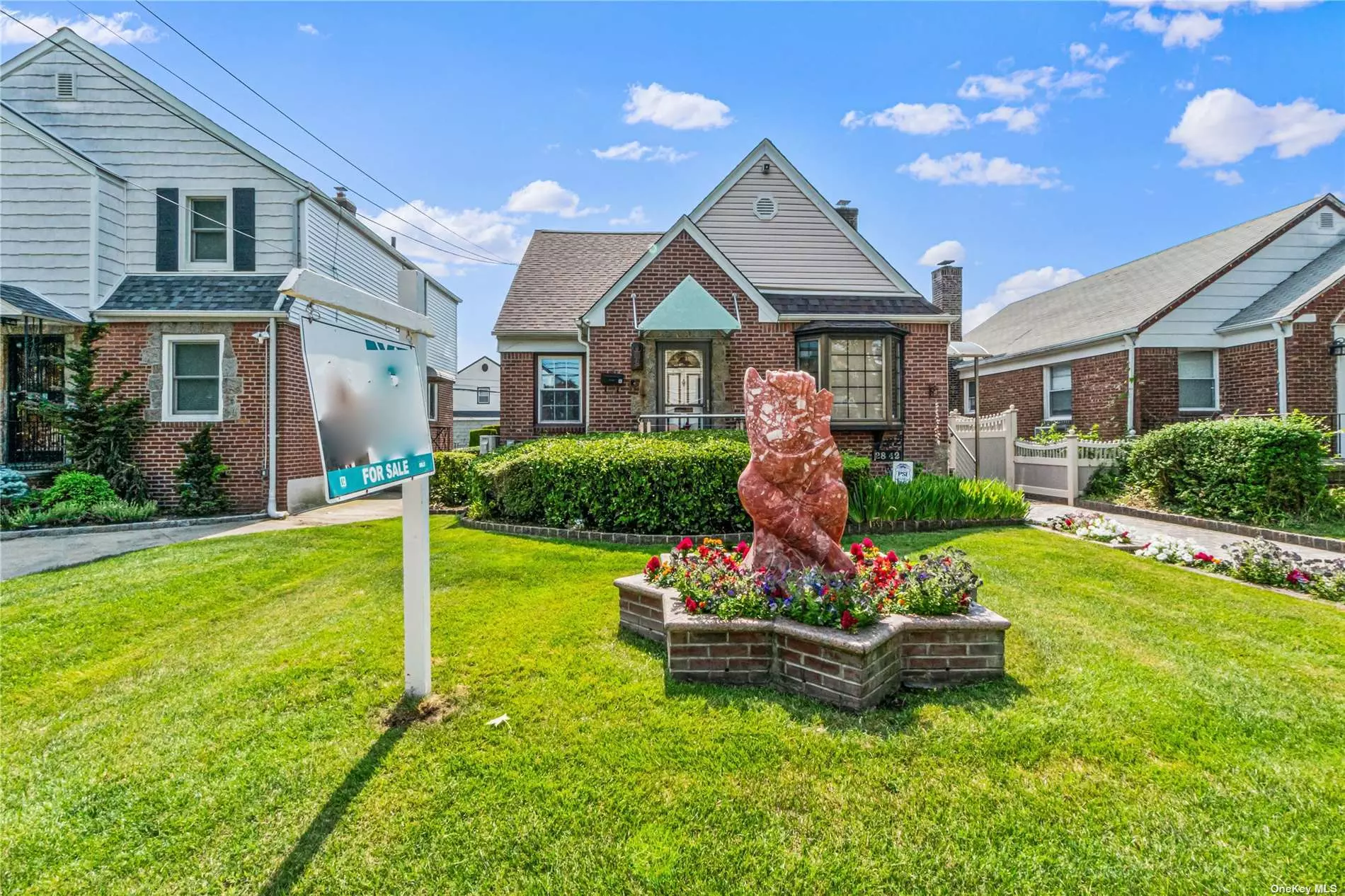 Charming, lovely, updated brick cape cod home located in the heart of Bayside. This beautiful house introduces on the first floor a large living room, elegant formal dining room, full bathroom, eat-in kitchen, and 2 bedrooms. The upstairs floor introduces a magnificent Huge master suite which has been fully dormered and opened to make it a stunning master suite. This beautiful home has a new roof, 5 zone sprinkler system, a finished basement, 4 camera video security system , a French drain perimeter basement flood prevention system, and central air, and ductless air systems. This house follows all the energy assessments by NYSERDA. This house has been fully brick pointed and has a locking gate to the driveway. Beautiful magnificent statues in front and back yard. Stonework throughout the perimeter and driveway.Beautiful landscaping throughout the property .Outdoor fully all season solarium connected to the garage