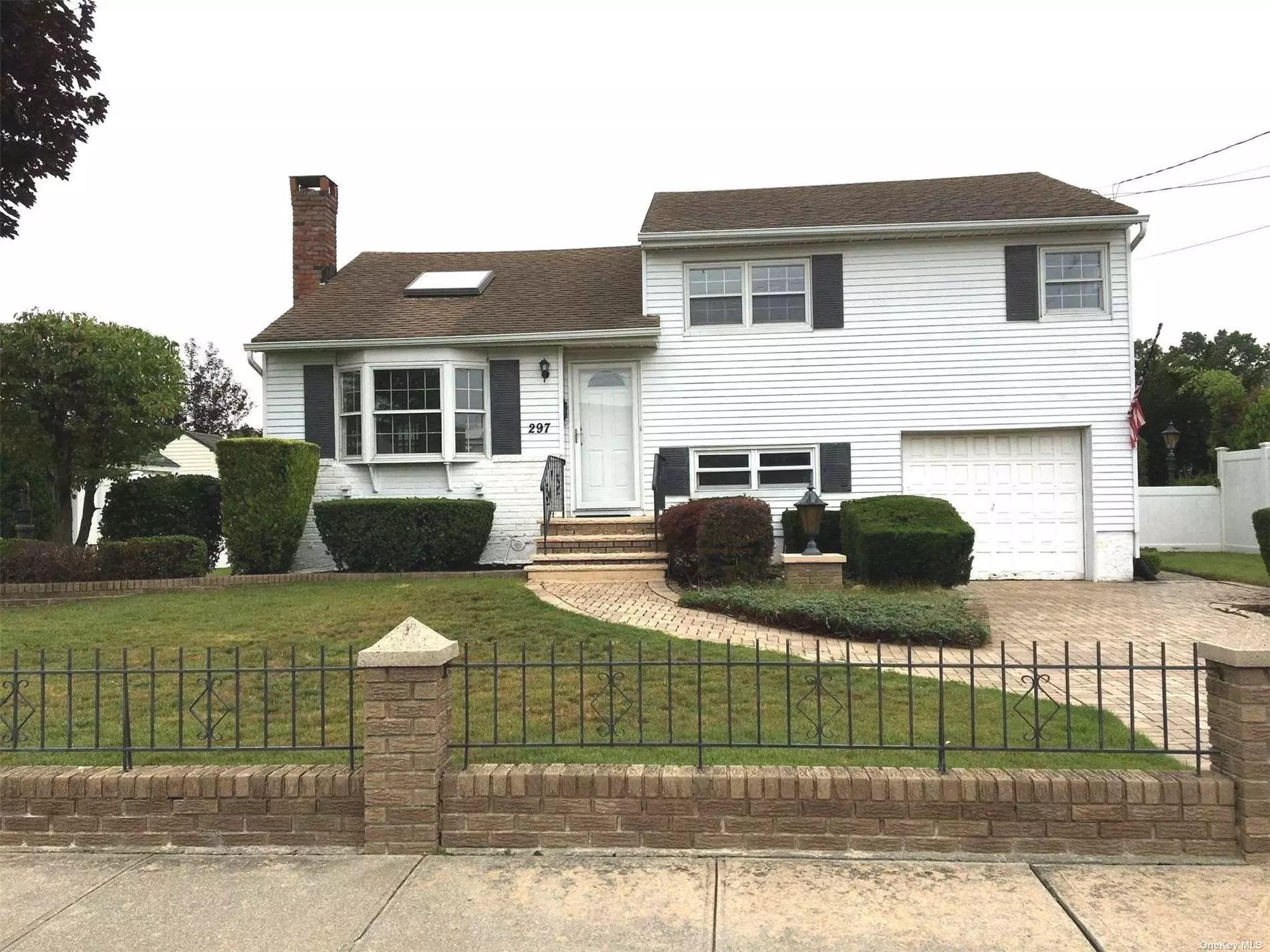 Mid block 3 bedroom 2 bath split level in prime North Massapequa.Updated kitchen with skylight and granite counter top.Living room with skylight.Home office plus family room plus finiished basement /fireplace.Nice size yard.