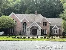 This newly rebuilt brick colonial has been remodeled to the finest version of elegance. A very long private driveway surprises you with a grand circular courtyard that can fit 20 cars. Over 3 acres. All new roof, kitchen, baths, floors, CAC, windows and back-up generator. Primary bedroom with office is on the main floor. Sunken great room with fireplace. The 50ft. pool is set privately with a true basketball court for the youngsters. This home is a true sanctuary. Cul-De-Sac. Jericho Schools.Home backs Muttontown Preserve. Diamond!