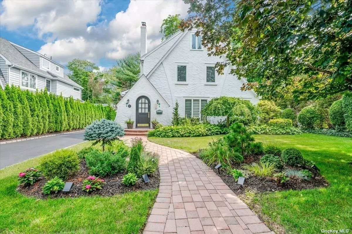 Welcome to this elegant one of a kind gem. This sunny & bright Tudor boasts a large formal living room with working fireplace, formal dining room, den and state of the art Eat-in-kitchen with doors leading out to a grand deck and beautifully manicured yard. This magnificent home has 3 bedrooms on the Second Floor with large primary suite with walk in closets and on suite bath w/radiant heat. Two additional bedrooms with bath and third floor. Finished basement with laundry and playroom completes this fabulous home. Located in the heart of the prestigious Village of Great Neck close to all shopping, transportation, parks & recreations. A MUST SEE!!!!!