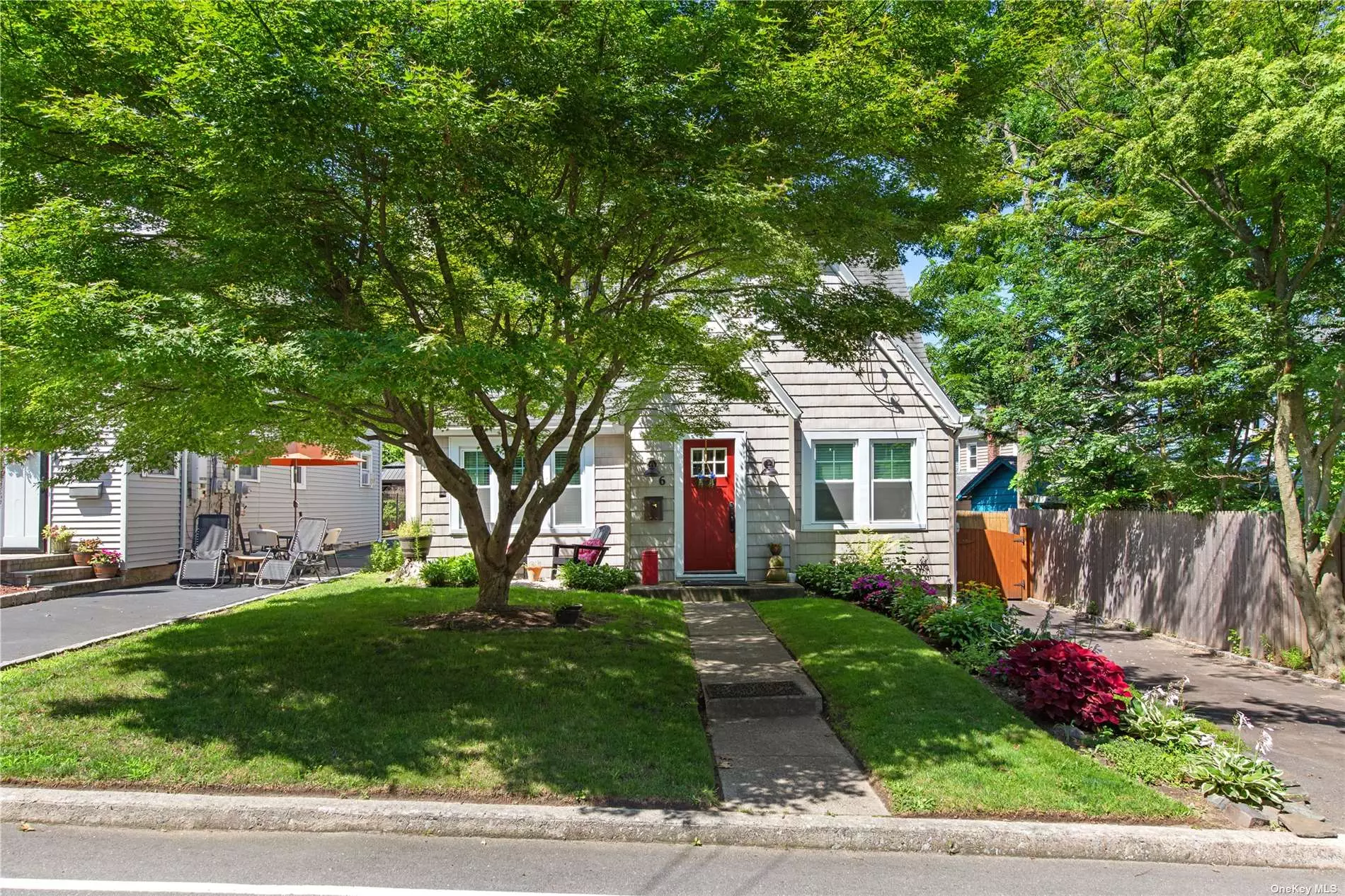 Quaint 3-bedroom home for sale in Glen Cove, NY, just one block from the water. Park-like landscaping, hot tub, new appliances, and roof. Charming interior, cozy living space, and updated kitchen. Private backyard oasis for entertaining. This is a Legal 2 Family being used as a single family.