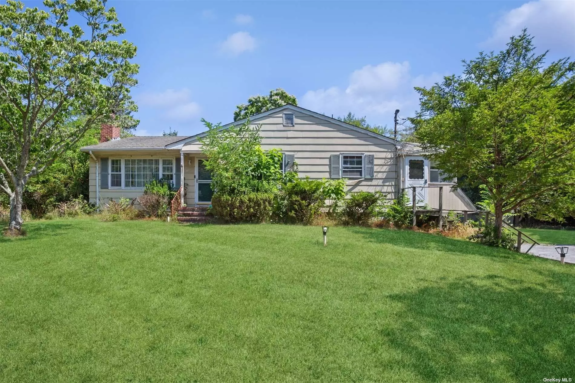 Opportunity knocks in Westhampton. Established three bedroom and two bath family home with fireplace, partially finished basement, two car garage and original pool is waiting for your creative touches. Conveniently located near shops, restaurants and the Village of Westhampton Beach