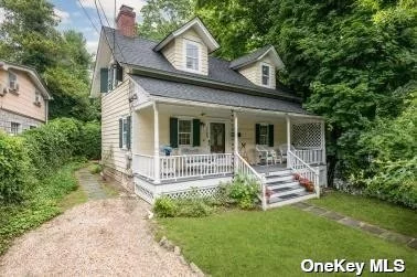 New to Market. If you love the architectural details and warmth of a historic home, the William J Strong House, circa 1840, in the delightful historic village of Roslyn will enchant you.  You can imagine yourself sitting on the broad, covered, front porch, supported by decorative columns in the evenings. In the parlor, you will note the wide plank pine floors and handsome fireplace. Adjacent to the parlor, there&rsquo;s a delightful room that could be used as either a dining room or a den, also with a wide-plank pine floor. A hallway leads to a powder room. The kitchen is reached through a vintage door from the parlor -- and this is where you will also find a shingled wall that indicates it was the original exterior of the house before an addition was added. The house was moved to this location in 1907, and was substantially rebuilt by the Roslyn Preservation Corp from 1994-1995 at which time the kitchen and upstairs addition were built. The former exterior wall was saved as part of this restoration. The kitchen not only includes plenty of room for a table and chairs, but also a pantry and a broom closet, as well as solid wood high-end kitchen cabinets. There are two staircases in the house. The original access to the second floor is enclosed in a cabinet in the parlor, while the second was added to the kitchen when the addition was built. Upstairs, there are wide-plank floors, and the spacious primary bedroom has a vaulted ceiling and lots of light. A second bedroom adjoins the primary, making it an ideal nursery, office, or sitting room. A third bedroom and a full bath are down a hallway. Yes. there&rsquo;s a basement too, entered in an ingenious fashion through the parlor. A doorway in the basement even leads to storage space under the porch. A door from the kitchen leads to a very private and secluded bluestone patio, where there&rsquo;s ample space for a table and chairs, as well as other furniture, and a grill with a gas connection. And that&rsquo;s not all! Climb the stairway from the patio, walk along a landscaped path, and you&rsquo;ll find an upper terrace also. The home enjoys central air conditioning and a security system,  Located about 25 miles from NYC, the house is a short distance from the LIRR, charming shops, fabulous restaurants, and beautiful Roslyn Park. Also, owners enjoy low taxes and the famed Roslyn schools.