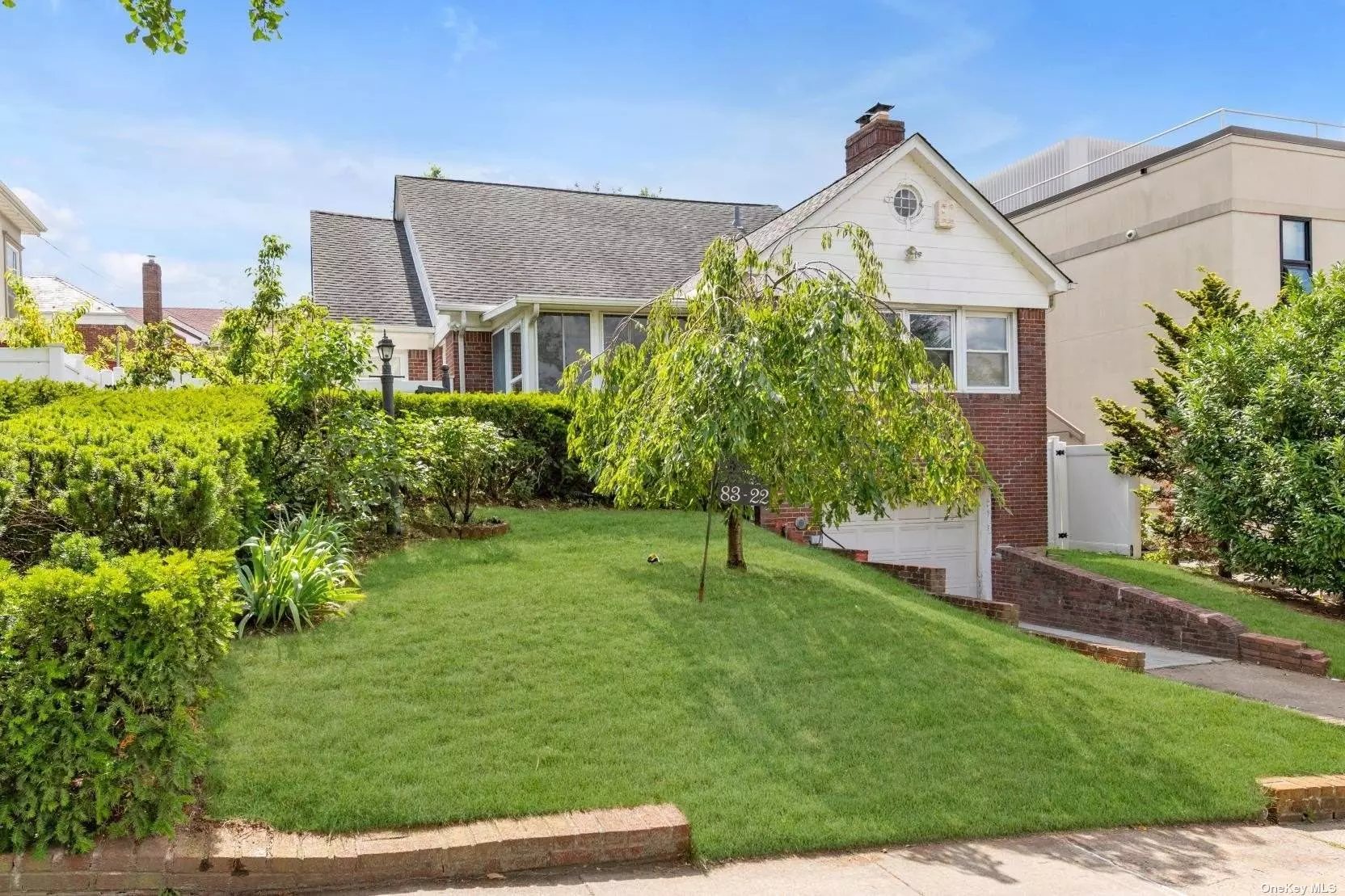 Spacious Cape Cod, Located in Jamaica Estates/Hollis Section Of Queens. This Beautiful 4 Bedroom Home Features A Primary Bedroom Suite On The First Floor, Large Living Room With Working Fireplace, Kitchen, Formal Dining Room. Two Additional Bedrooms And A Full Bathroom Are Located On The Second Floor. The Full Finished Basement With Garage Access, Includes A Family Room, Bathroom, Mechanical Room. Close to Schools, Transportation, Shopping