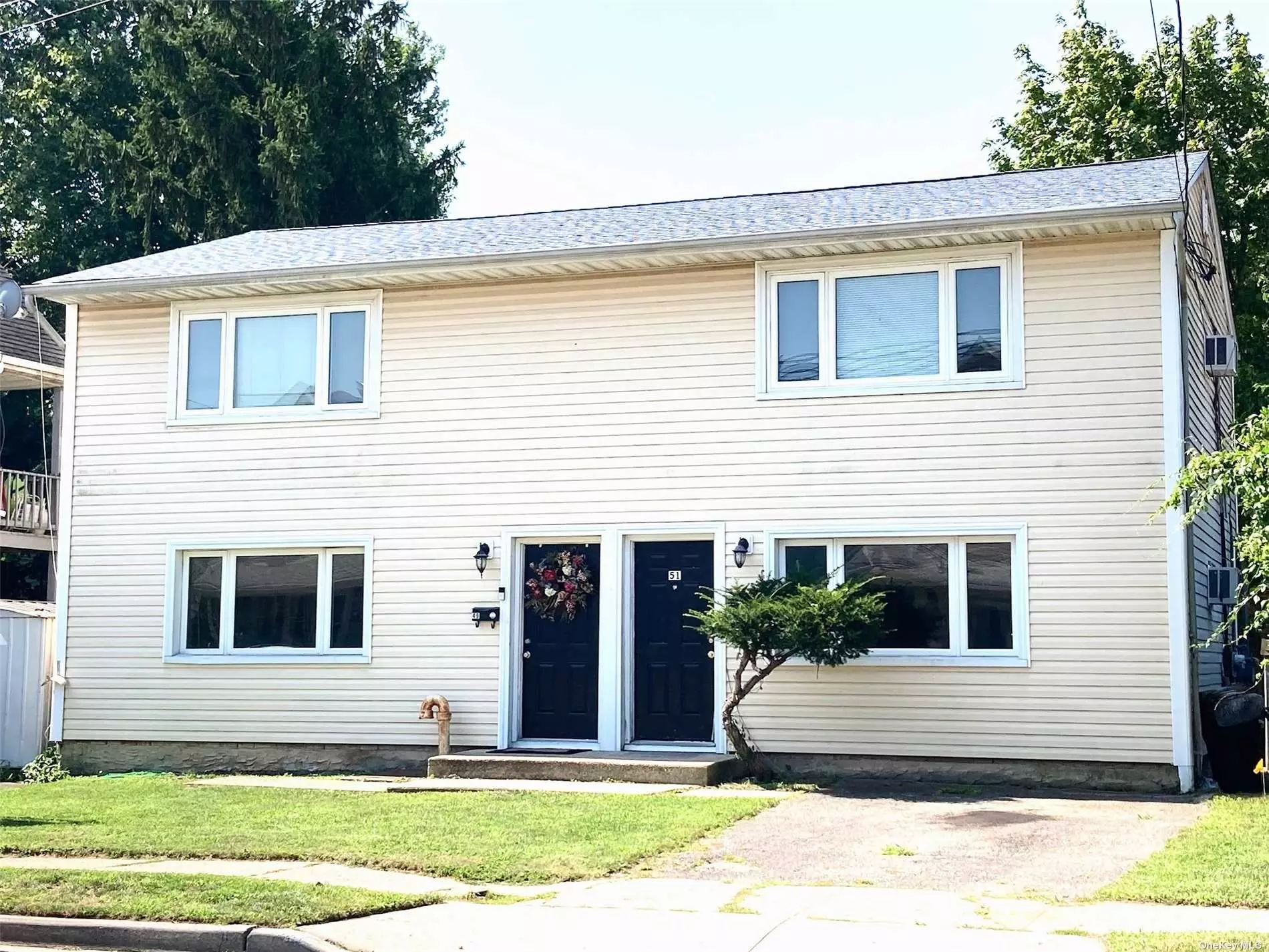 Wonderful 2 Family home with Water Views! Situated steps from Park, Beach, LIRR, Restaurants, Childcare, School, Shops. Great Investment Opportunity. Newly refinished Wood Flooring throughout. New roof. Windows, Heating, Electric all updated. Each unit has own laundry hookup and private driveways.