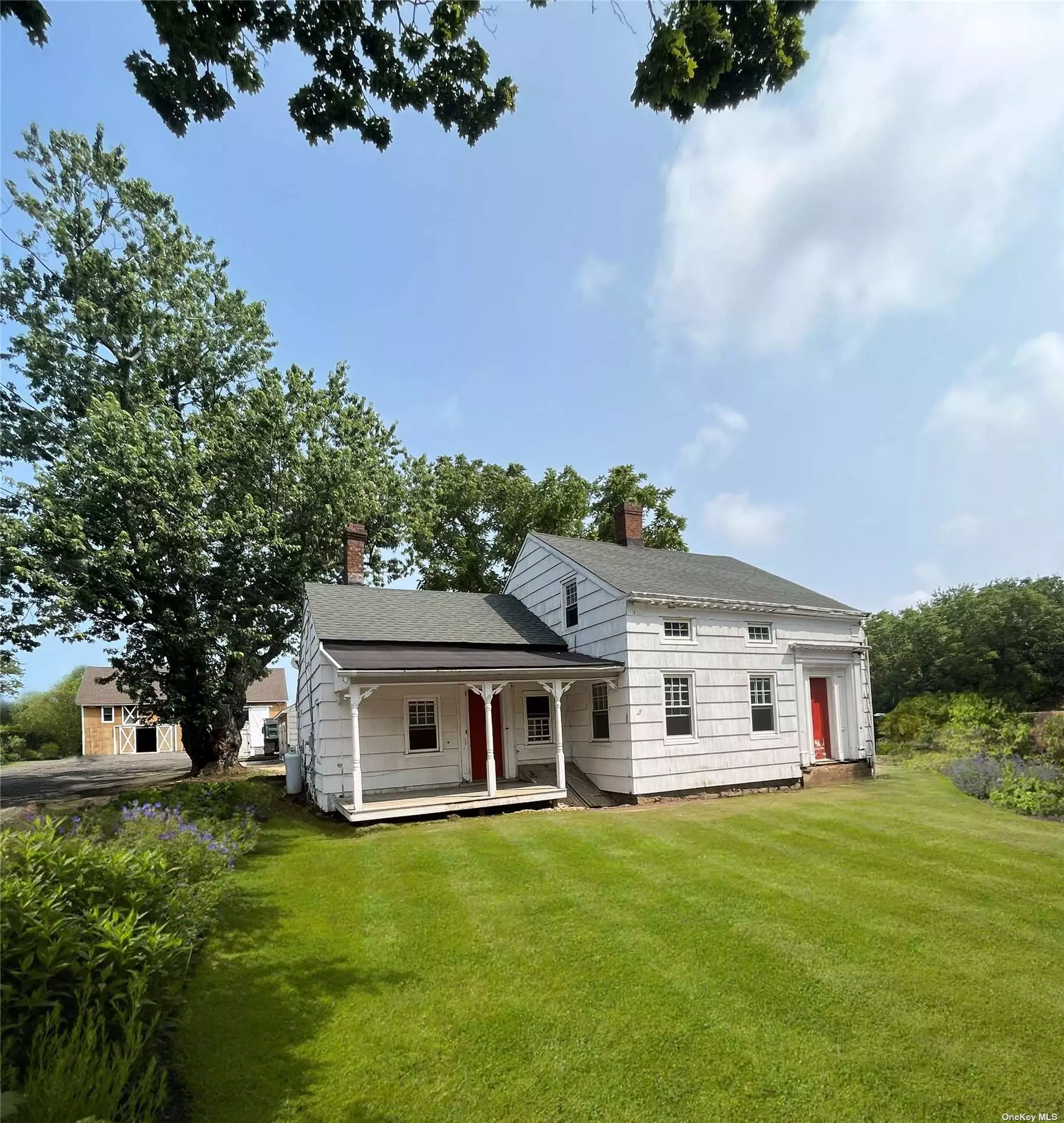 Restored and rejuvenated. This beloved 24 acre North Fork homestead features a charming white farmhouse with 3 bedrooms, 2 bathrooms (to be renovated or can build to suit) on 24 acres with 5 accessory buildings. 4 barns and a 2 car garage. Barn 1 is a 2, 400 Square Foot, 2 Story Barn (50x30), Barn 2 is 20x30 single story built in 2015 and two 400 sqft accessory barns. This farm features two lots, 4.18 acres with 244&rsquo; of main road frontage and 20 acres of DRS agricultural land with 2 irrigation wells. Zoned R-80, the front 4 acres can be subdivided into 2 parcels and there is an approved commercial use of riding academy for the equestrian buyer. Owner is builder and will customize as residential, farm winery with vineyard or equestrian site. Room for pond, pool, tennis, pickleball or sunken riding ring and stables.