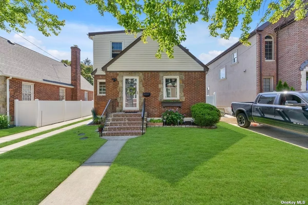 Oversized Expanded Detached Cape in Prime Bayside. The First Floor Offers a Living Room, Dining Area, Updated Kitchen with Hi-Hats, Granite Countertops, and Tall Custom Cabinets. The First Floor Also Holds Two Bedrooms and One Full Bathroom. The Second Floor Has Two Additional Bedrooms and Another Full Bathroom. Fully Finished Basement with Large Family Room, Laundry Room/Boiler Area, Workshop, and OSE. Spacious, Sun Soaked Yard with Paver Patio, and Detached One Car Garage. Loads of Updates Throughout! Ductless Air Conditioning, Oak Hardwood Floors, Vinyl Windows, Updated Electric, New Boiler & Hot Water Tank, Updated Roof in 2017, Closets Galore, and a New Retaining Wall in the Backyard! Located Conveniently Near Schools, Shops, and Various Modes of Transportation.